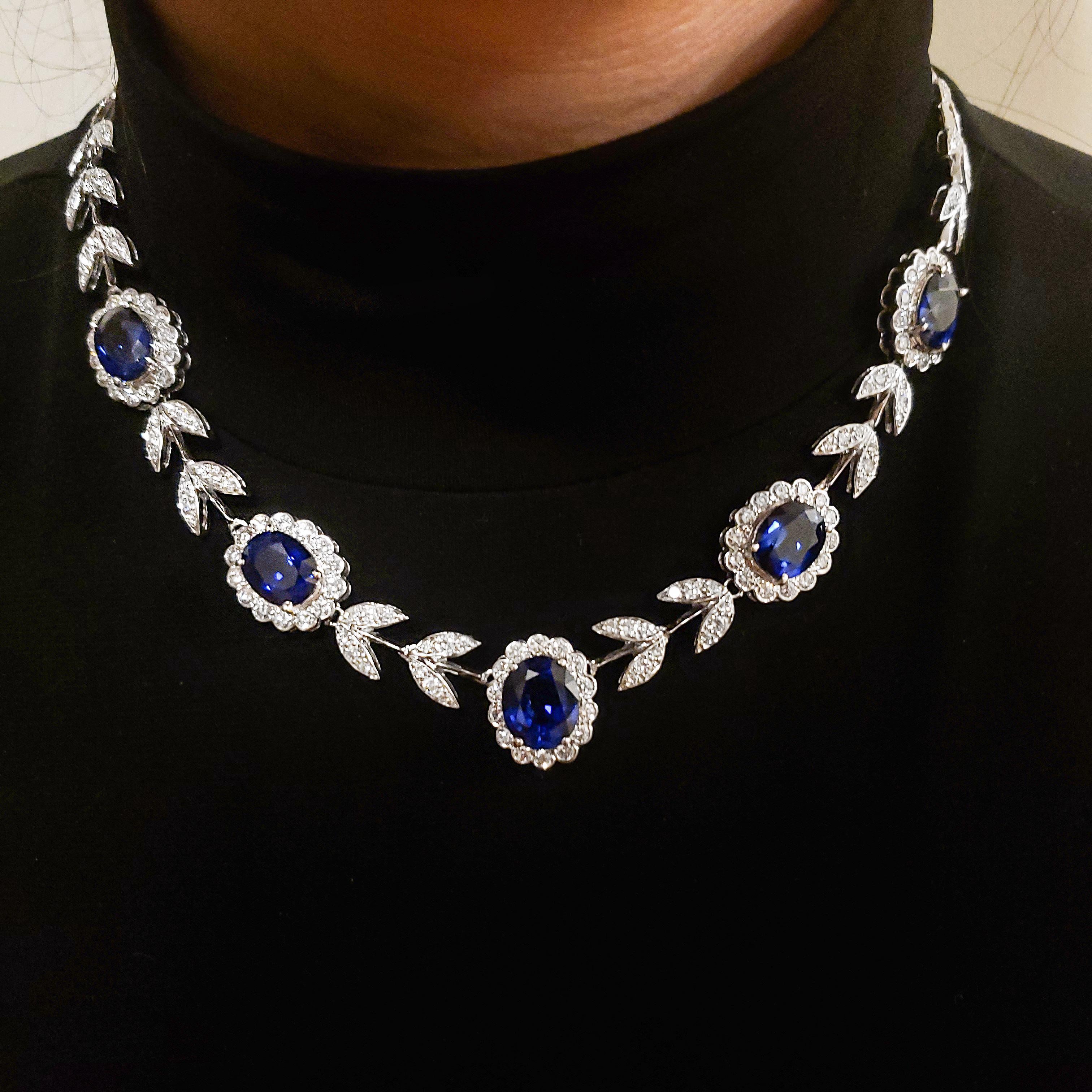 Contemporary 20.65 Carat Oval Cut Blue Sapphire and Diamond Halo Flower Necklace For Sale