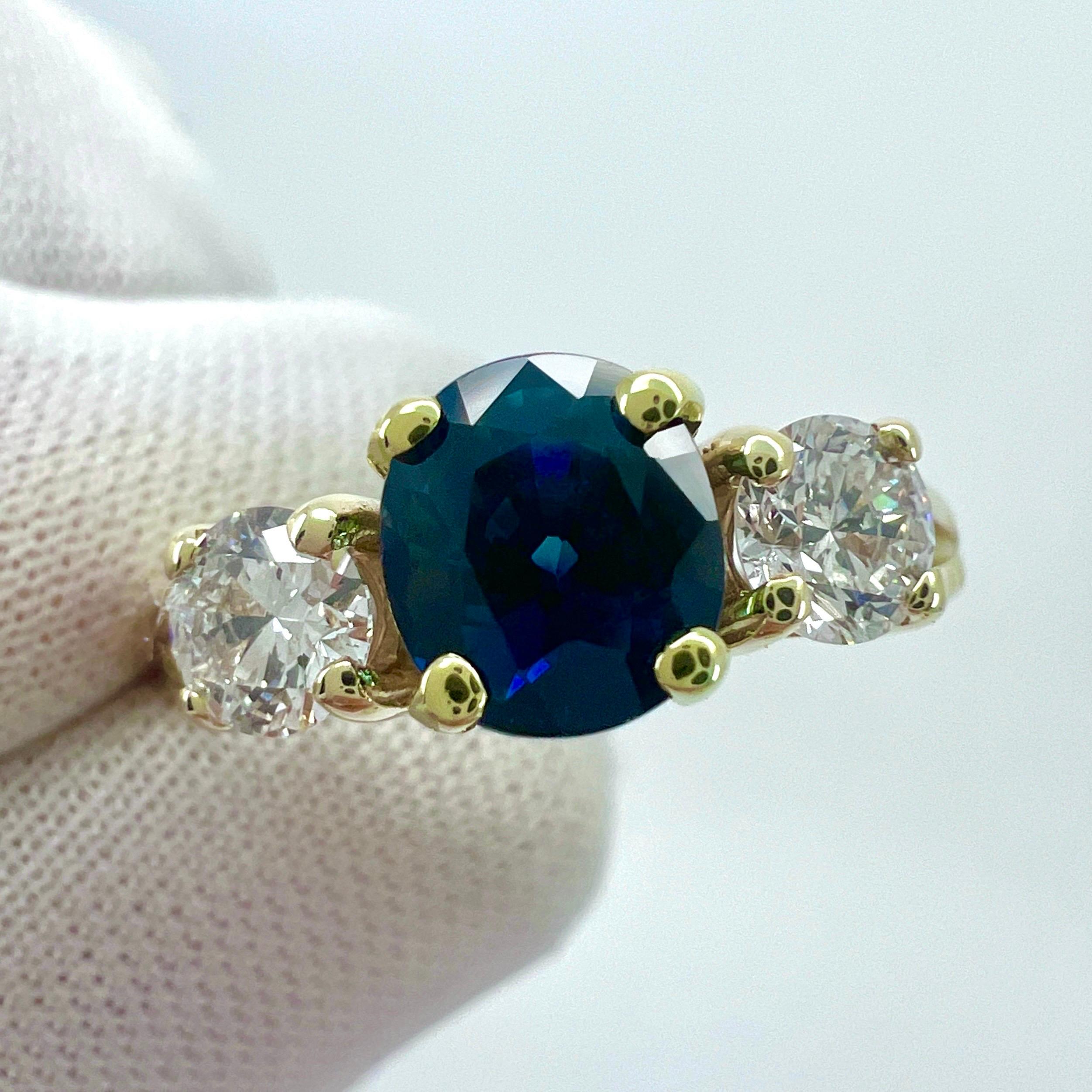 GIA Certified Deep Blue Sapphire And Diamond Three Stone 14k Yellow Gold Ring. 2.06 Total Carat.

1.56 Carat centre sapphire with a deep blue colour and excellent clarity, a very clean stone. Also with an excellent oval cut showing the fine colour