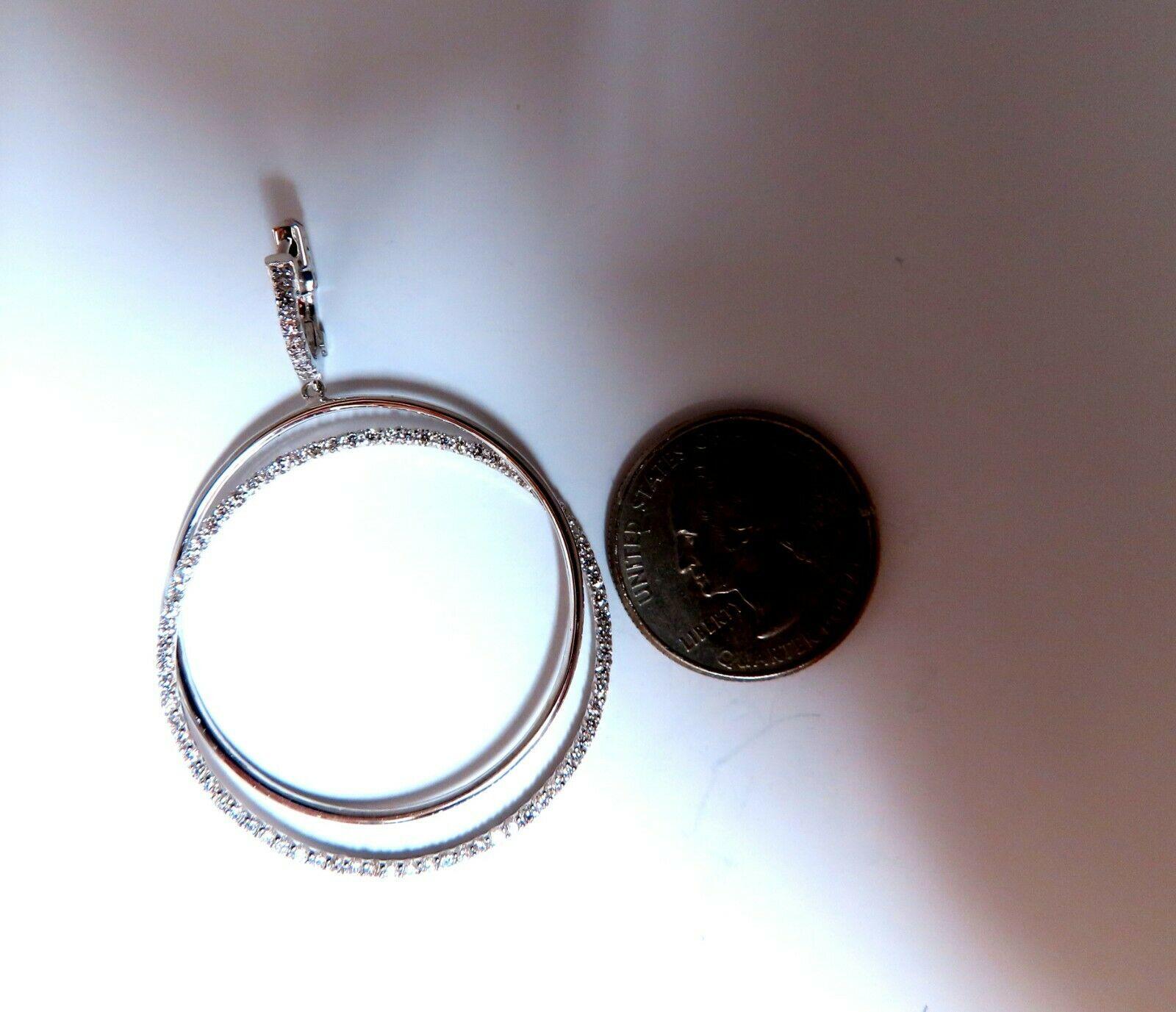 Circle loop earrings.

The Modern Dangle.

2.06cts of natural round diamonds: 

G-color, Vs-2 clarity.

14kt. white gold

11.7 grams.

Earrings measure: 2.2 inch long 

1.5 inch diameter on each ring

.50 inch hoop

Comfortable Lever snap on the