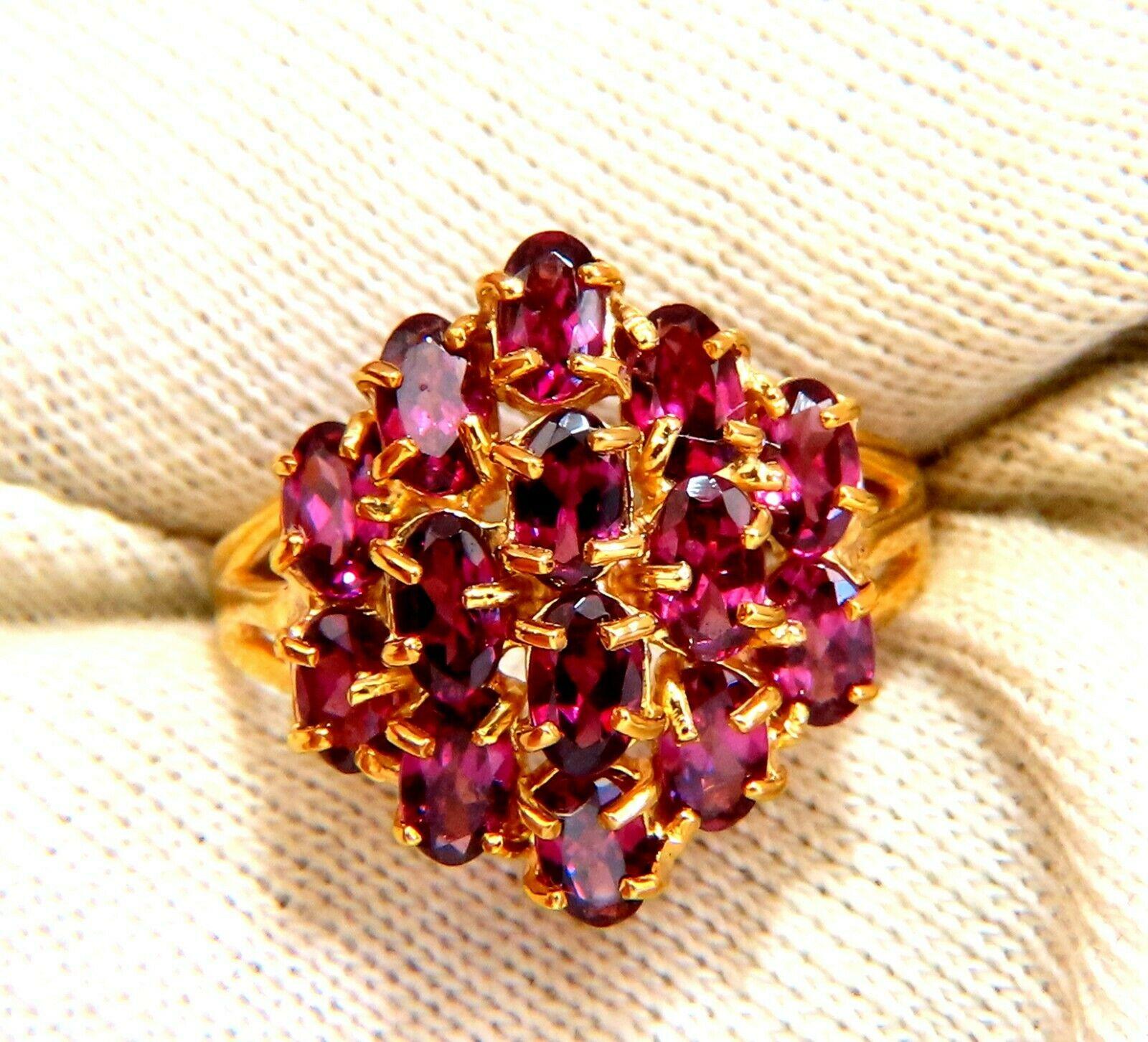 2.06ct natural oval garnet cluster ring.

Dome mounted cocktail raised.

Clean clarity vivid red and transparent.

Ring is 19 mm wide

7 mm depth.

10 karat yellow gold 4.3 grams

Size 10 and we may resize.