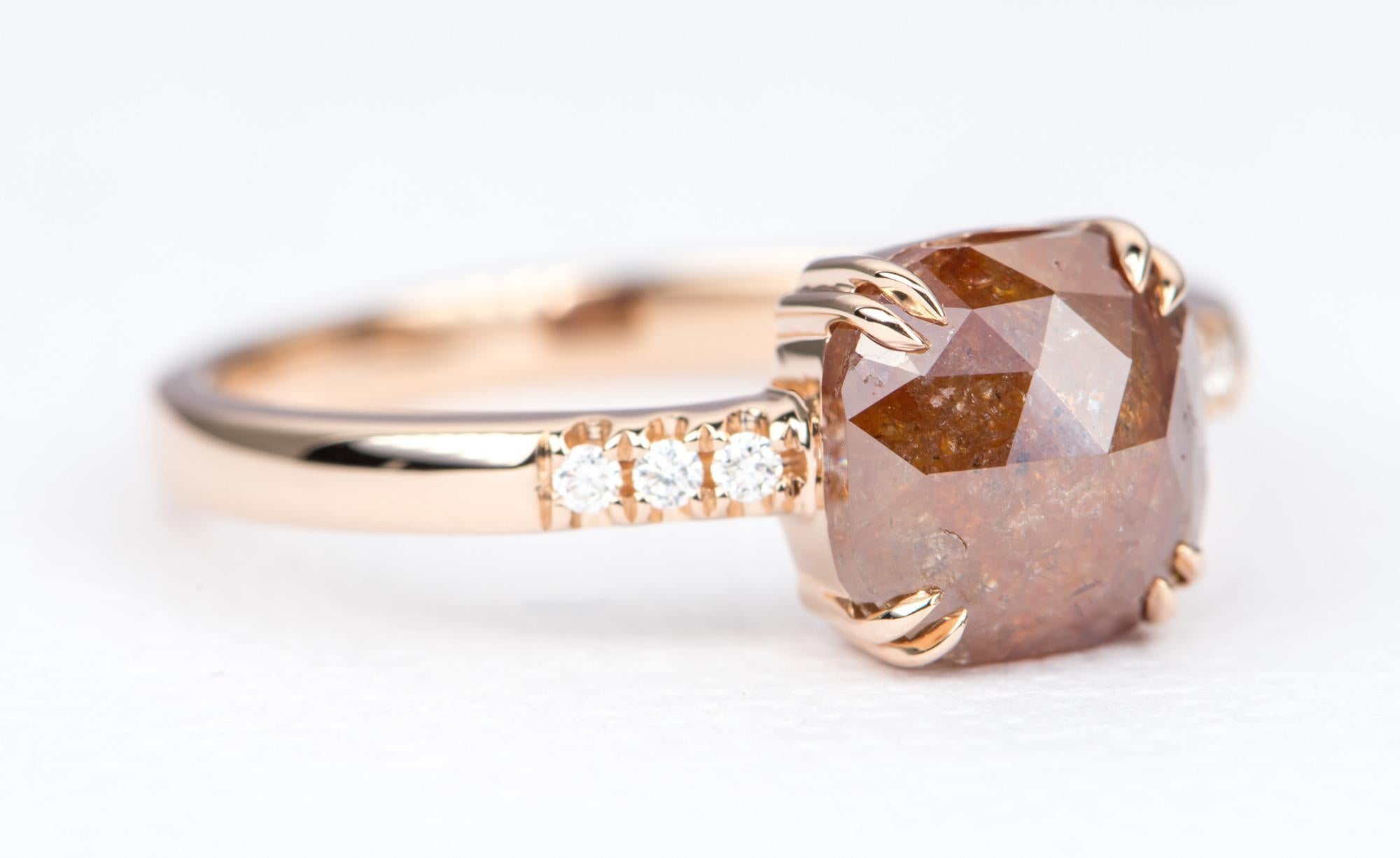 ♥  A stunning reddish  brown diamond is set on a solid 14k rose gold setting with double prongs at the corners of the setting.
♥  The shank has brilliant cut colorless diamonds on each side. It complements the rustic nature of the center stone
