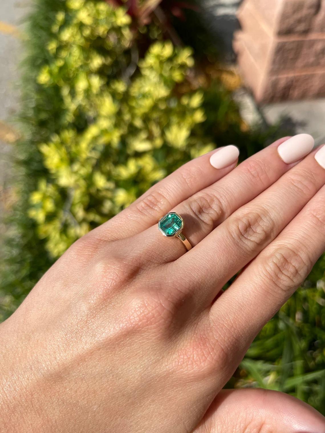 bezel set emerald ring