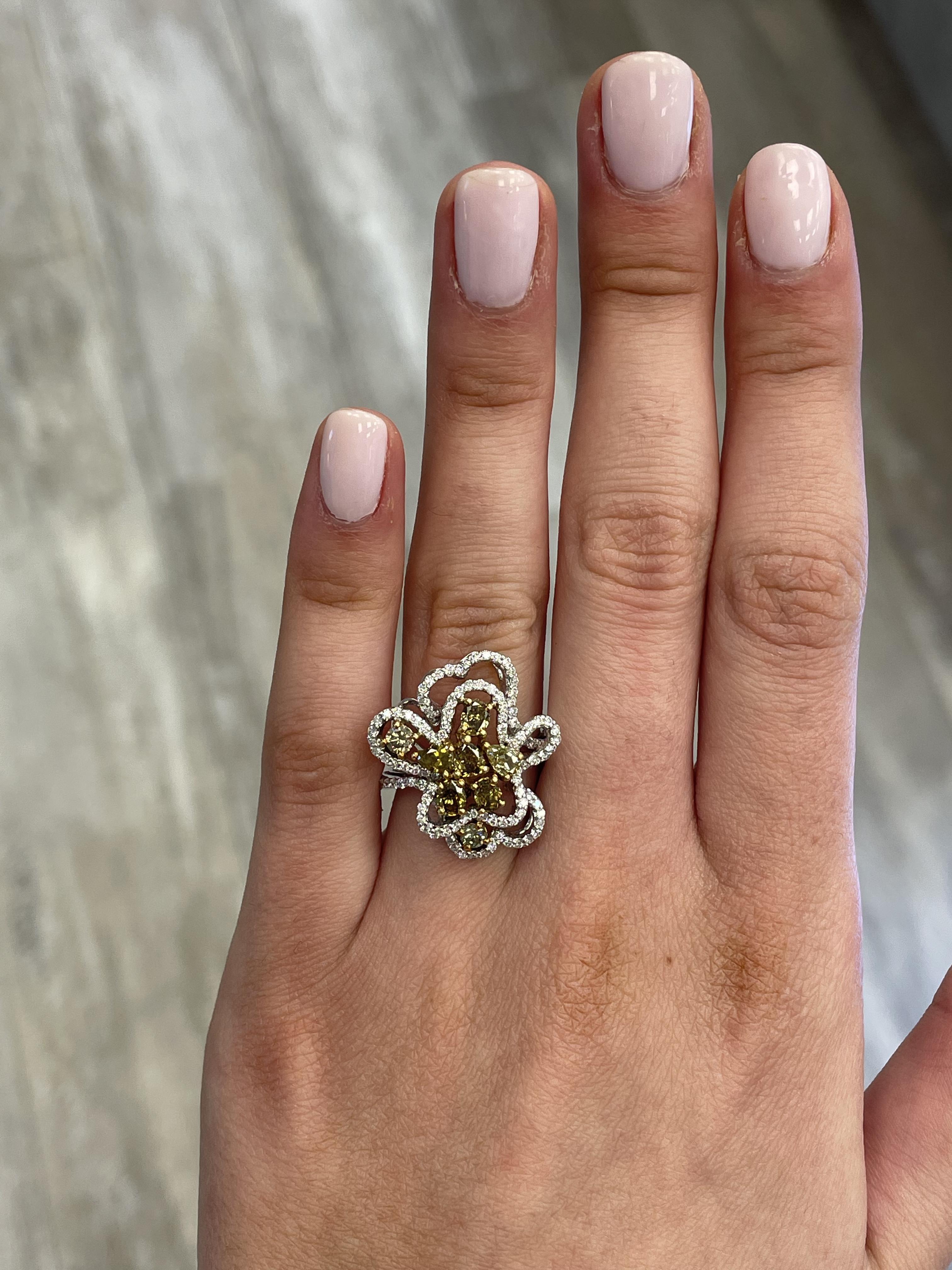 Lovely brown diamond cluster ring.
2.06 carats total diamond weight.
10 mixed heart, pear, and oval diamonds, 1.41 carats. Approximately Fancy Greenish Yellowish Brown color diamonds SI clarity. Complimented by 118 round cut diamonds, 0.65 carats