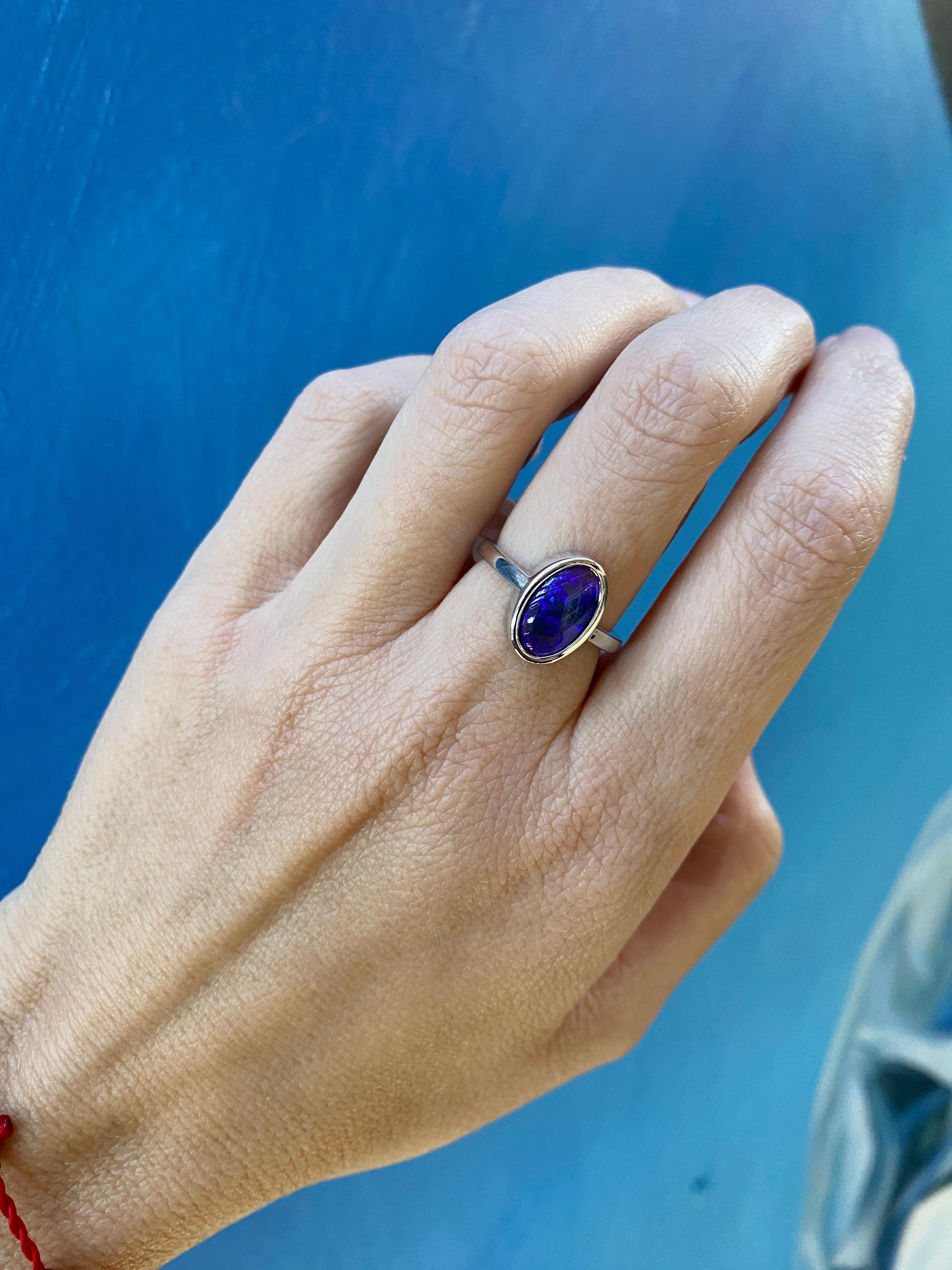 2.07 Carat Blue Oval Opal Bezel Set 18 Karat Gold Ring For Sale 6