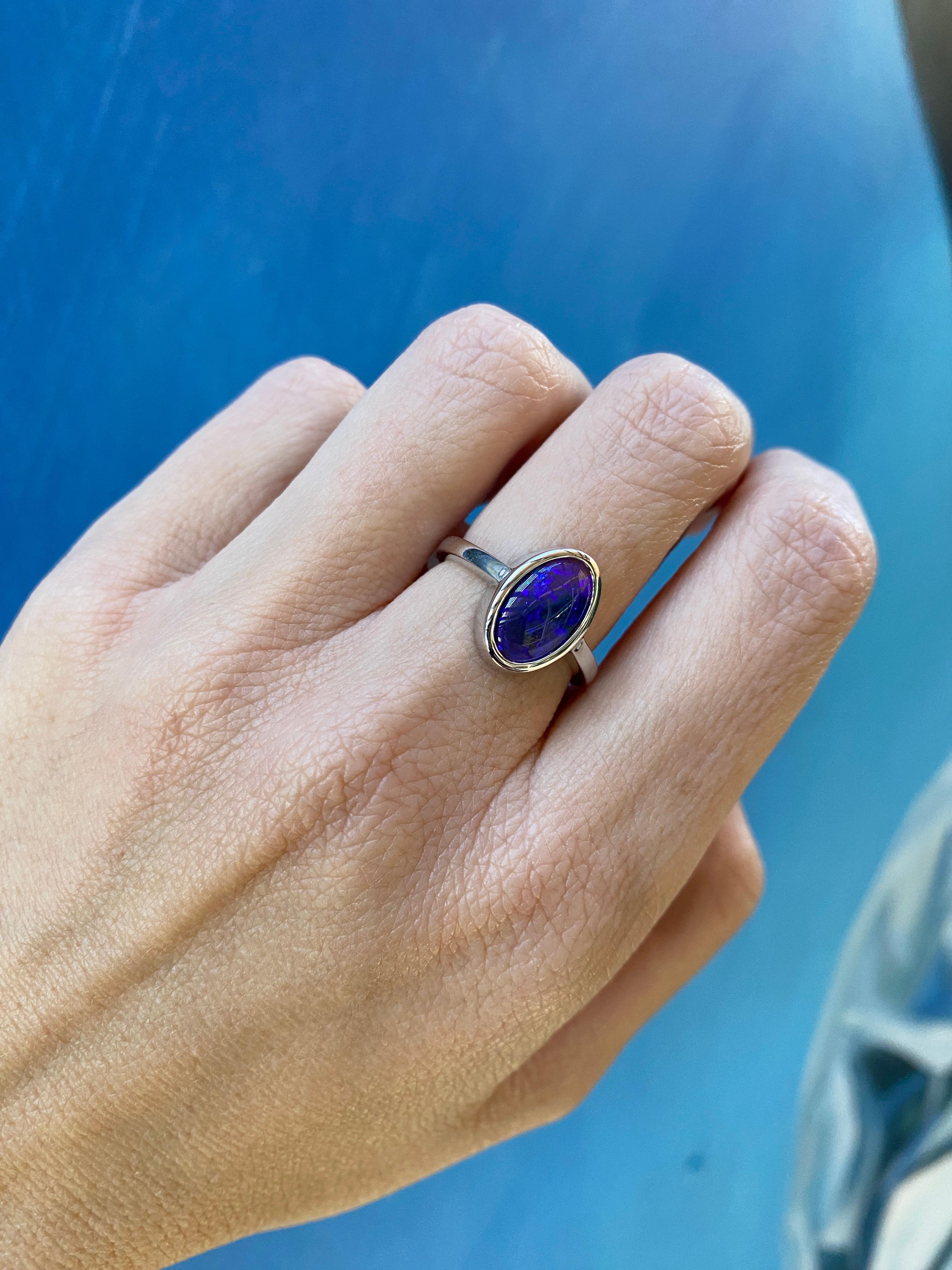 2.07 Carat Blue Oval Opal Bezel Set 18 Karat Gold Ring For Sale 7
