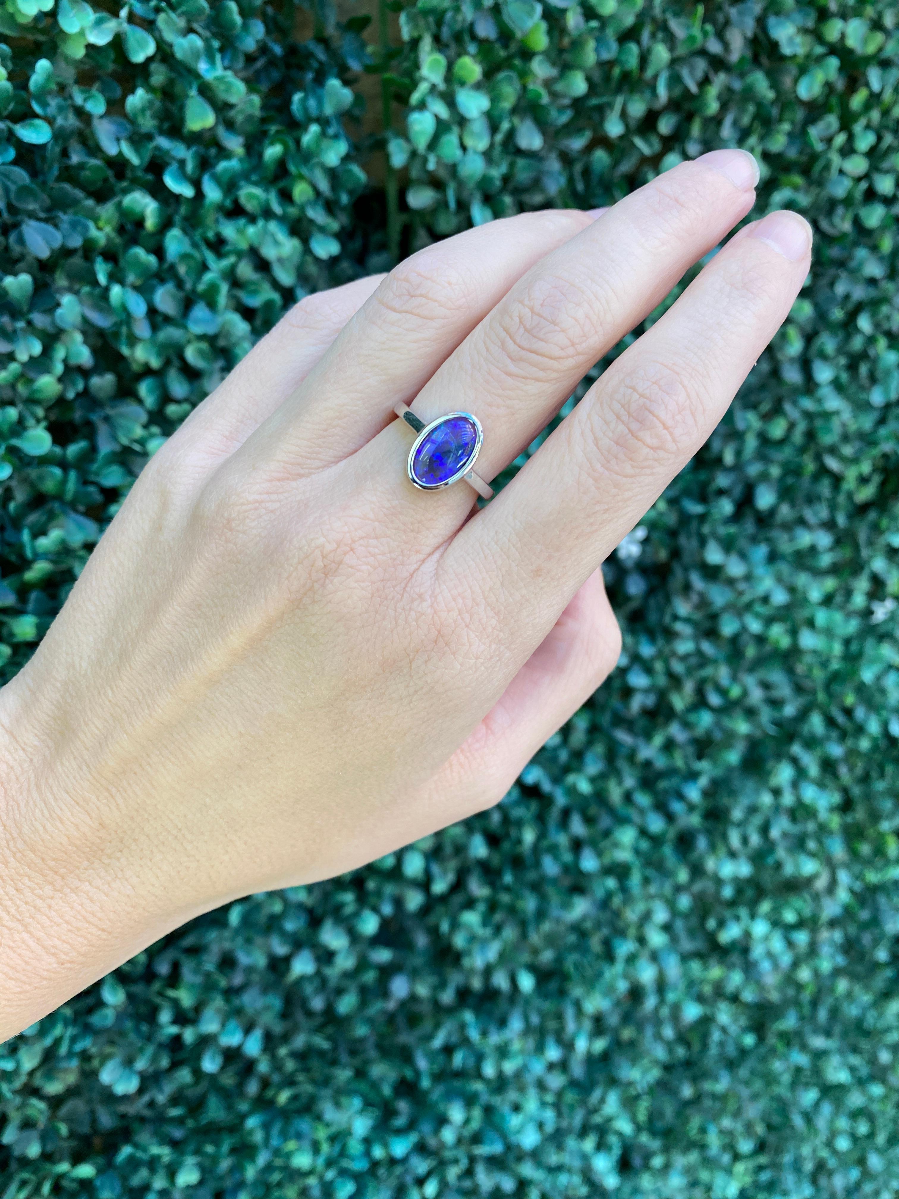 2.07 Carat Blue Oval Opal Bezel Set 18 Karat Gold Ring For Sale 8