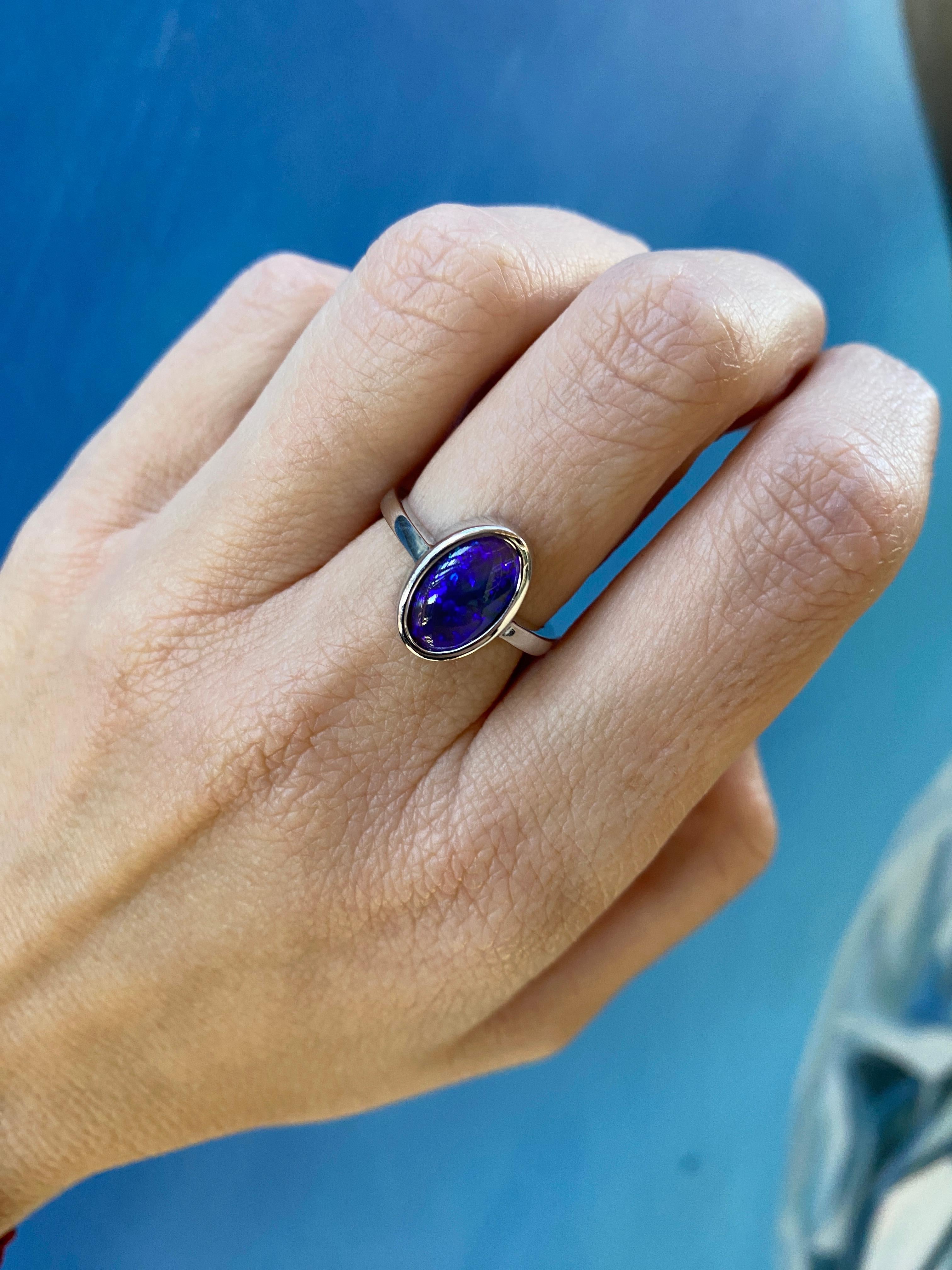 2.07 Carat Blue Oval Opal Bezel Set 18 Karat Gold Ring For Sale 10