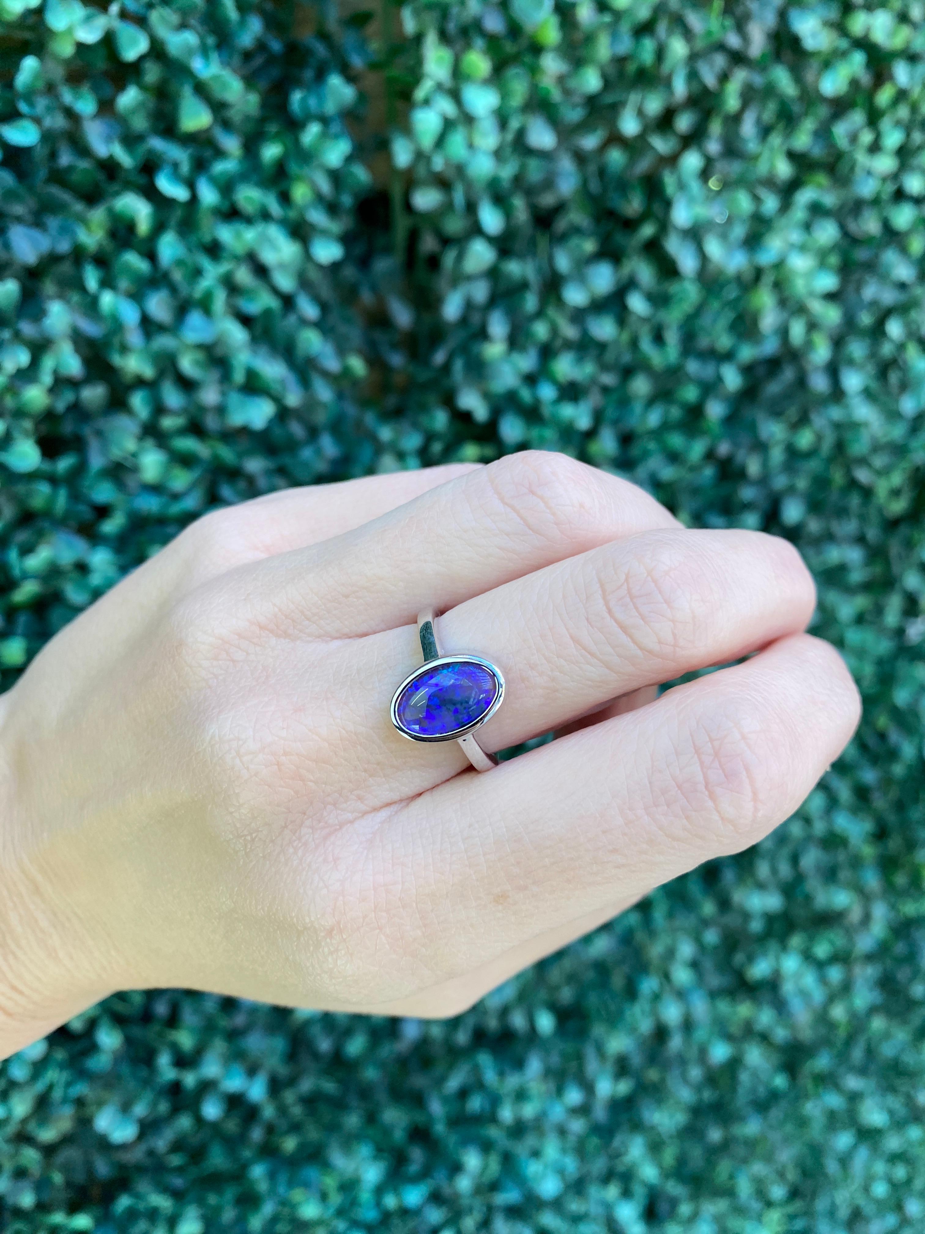 2.07 Carat Blue Oval Opal Bezel Set 18 Karat Gold Ring For Sale 11