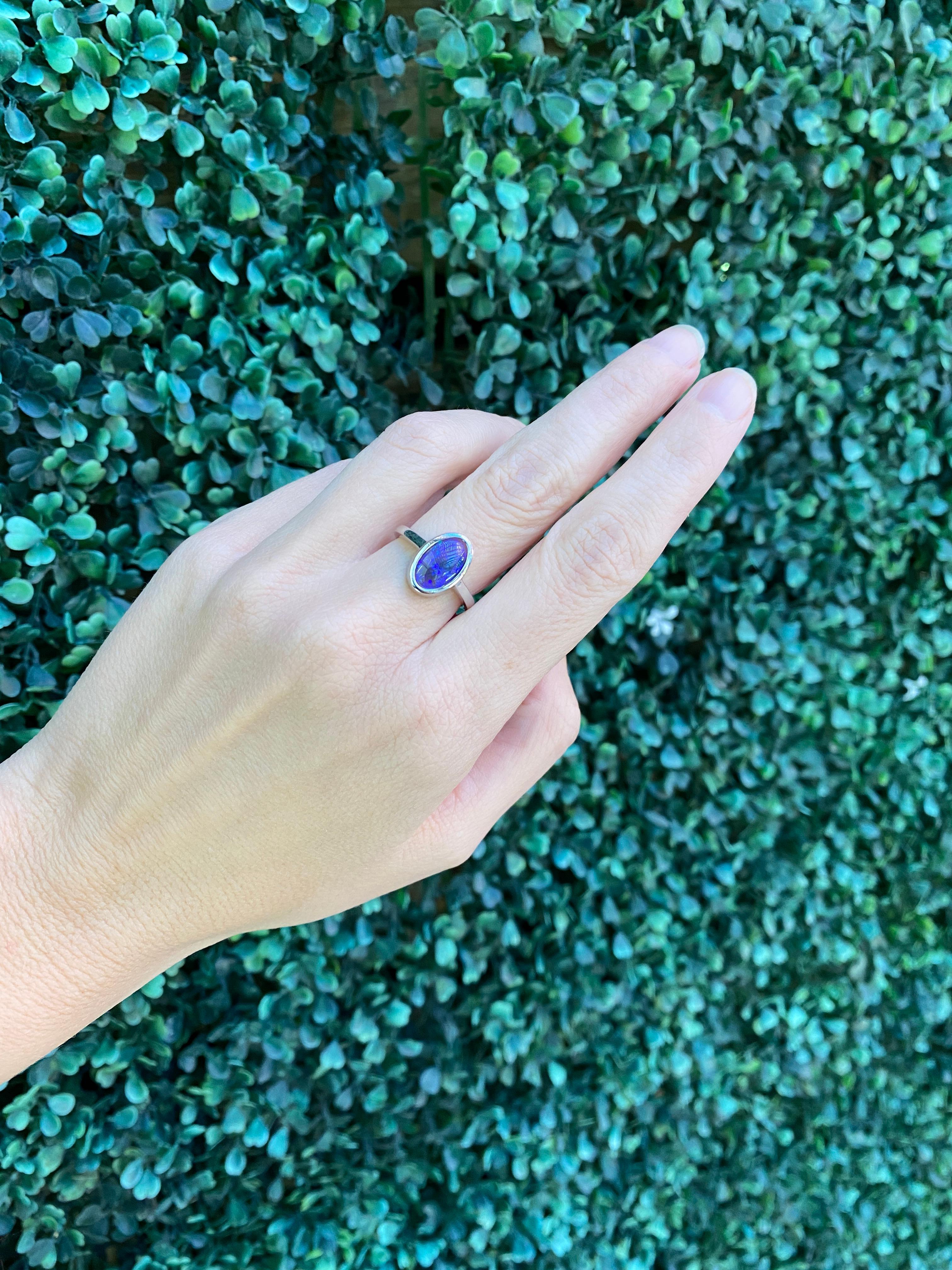 2.07 Carat Blue Oval Opal Bezel Set 18 Karat Gold Ring For Sale 12