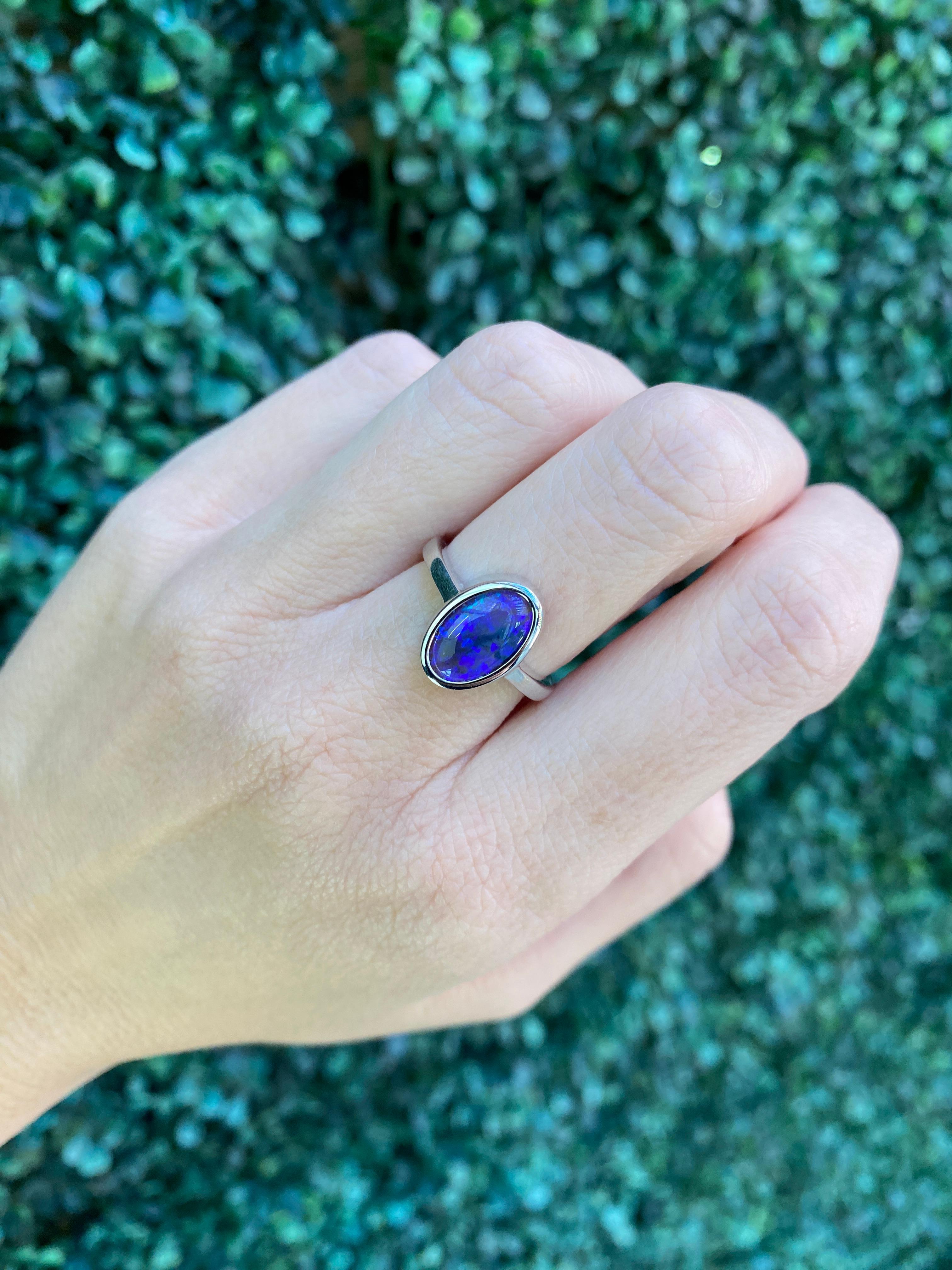 2.07 Carat Blue Oval Opal Bezel Set 18 Karat Gold Ring For Sale 13
