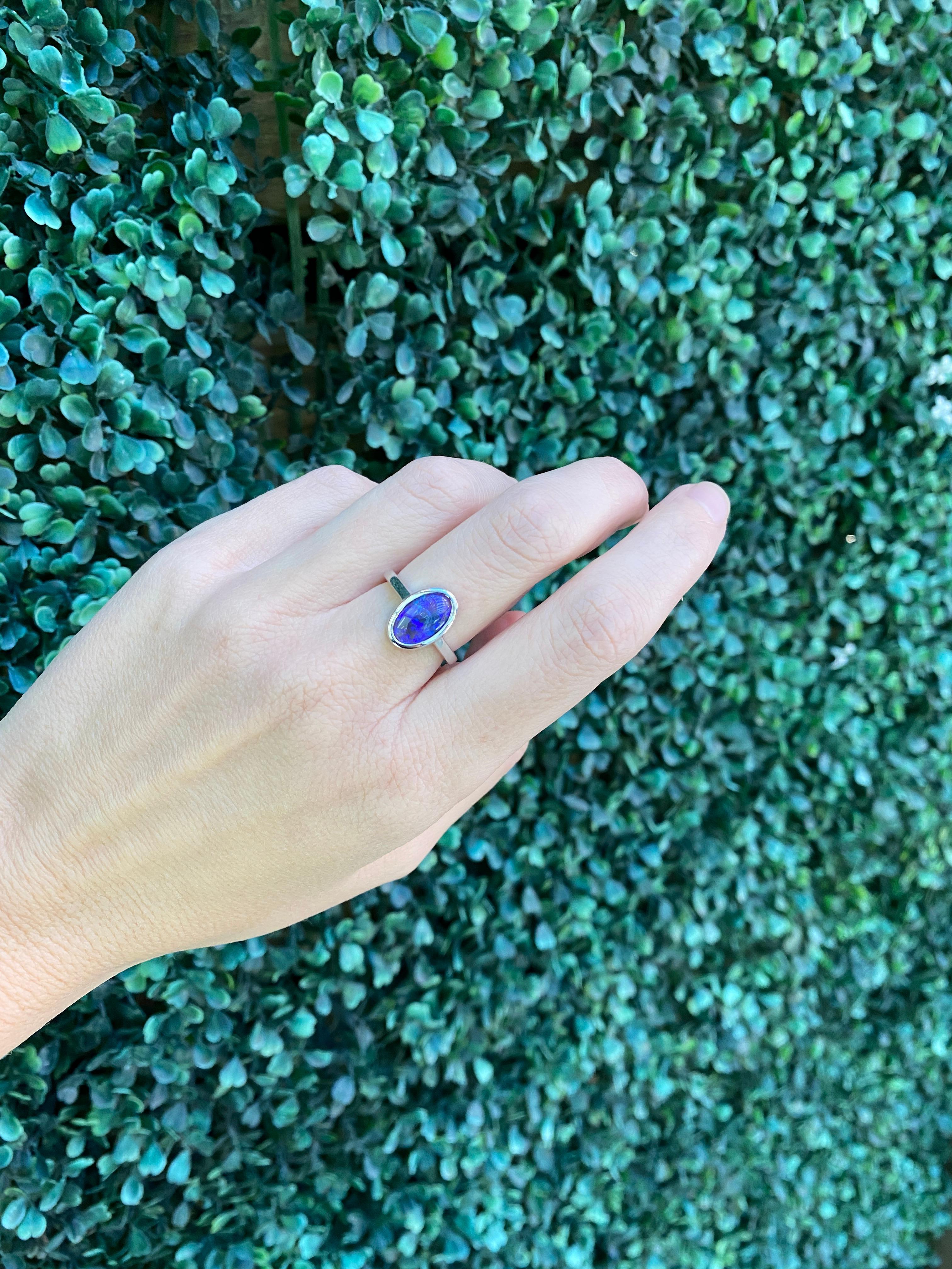 2.07 Carat Blue Oval Opal Bezel Set 18 Karat Gold Ring For Sale 14
