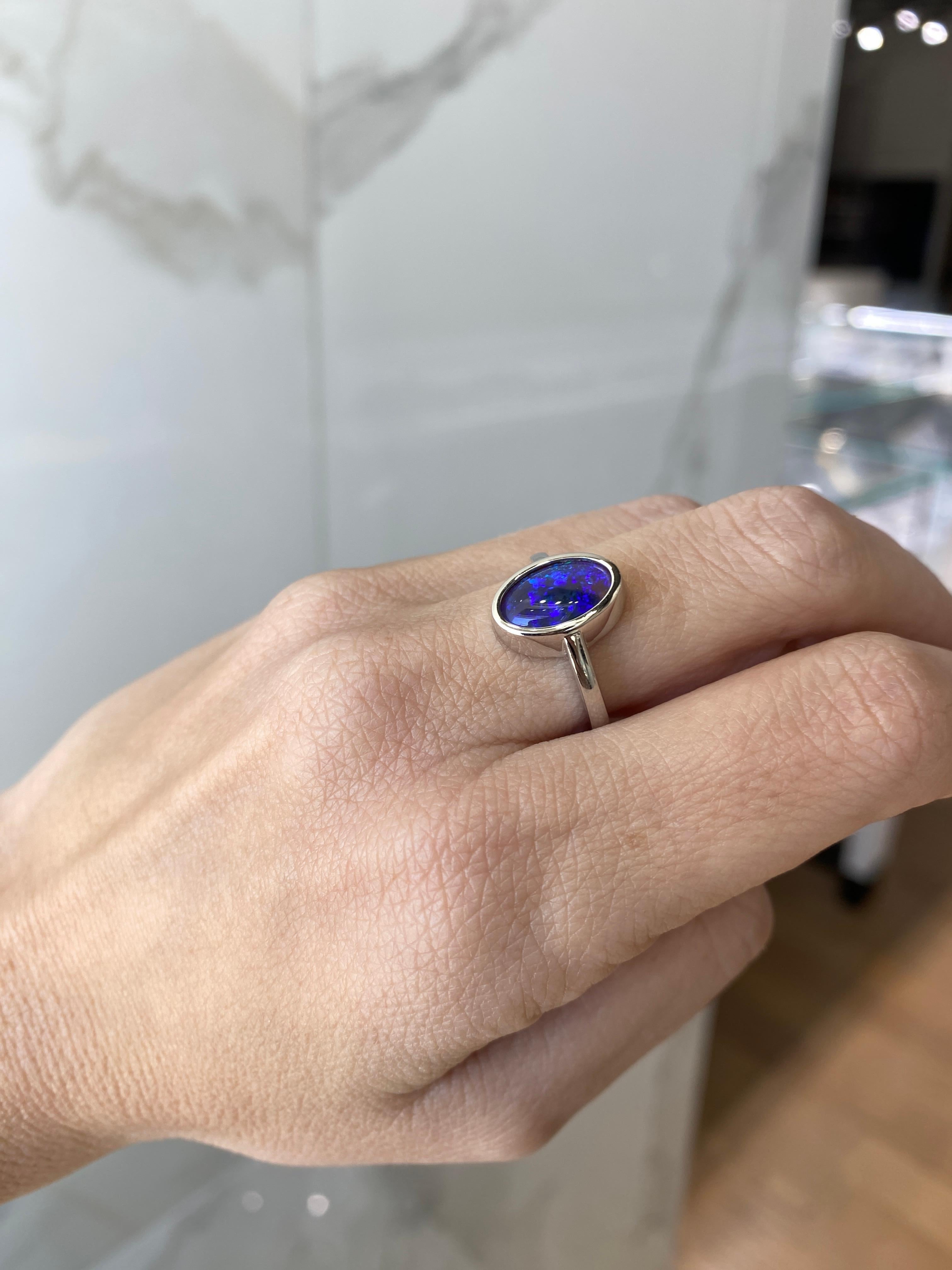 2.07 Carat Blue Oval Opal Bezel Set 18 Karat Gold Ring In New Condition For Sale In Houston, TX