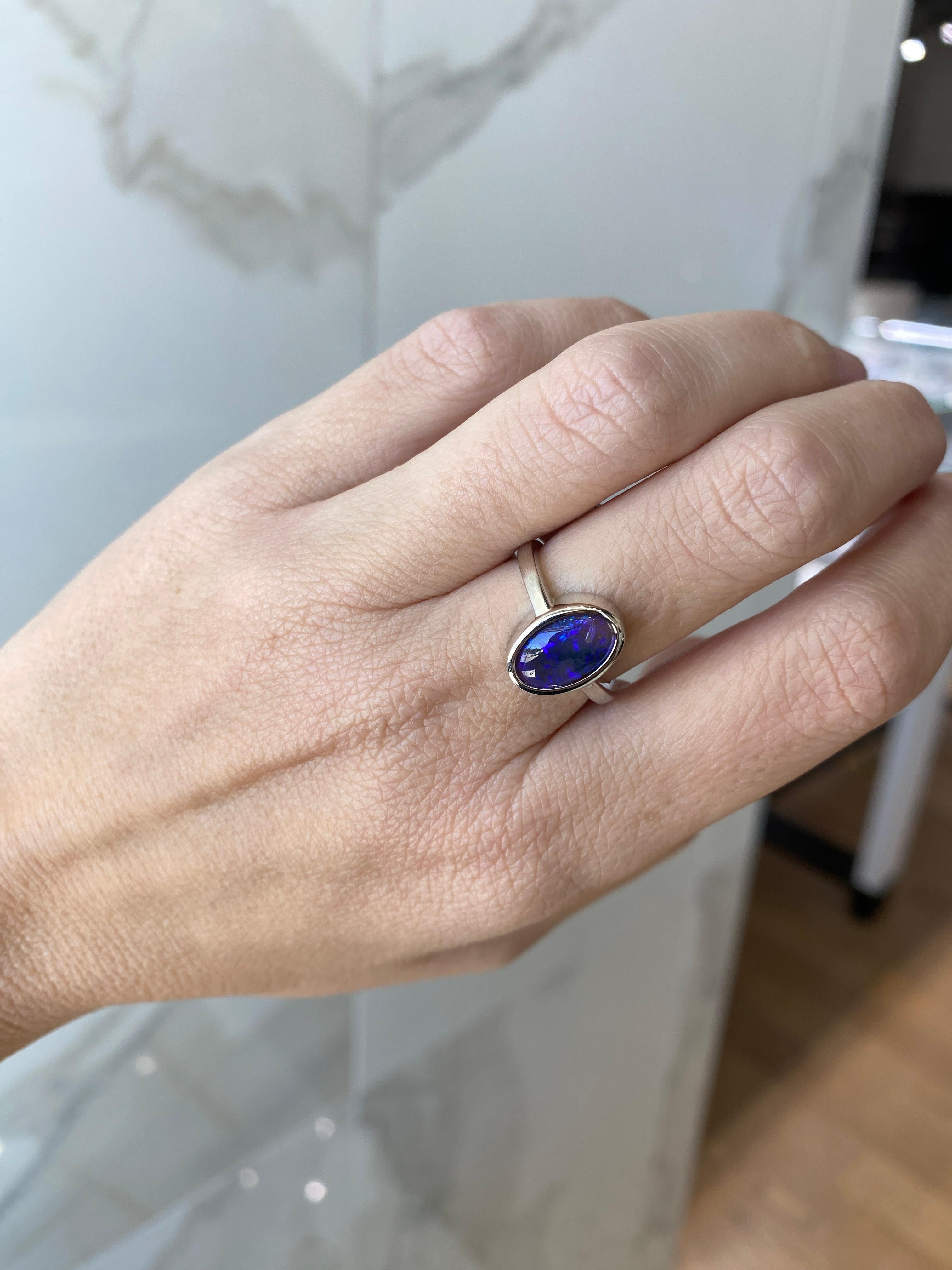 Women's or Men's 2.07 Carat Blue Oval Opal Bezel Set 18 Karat Gold Ring For Sale