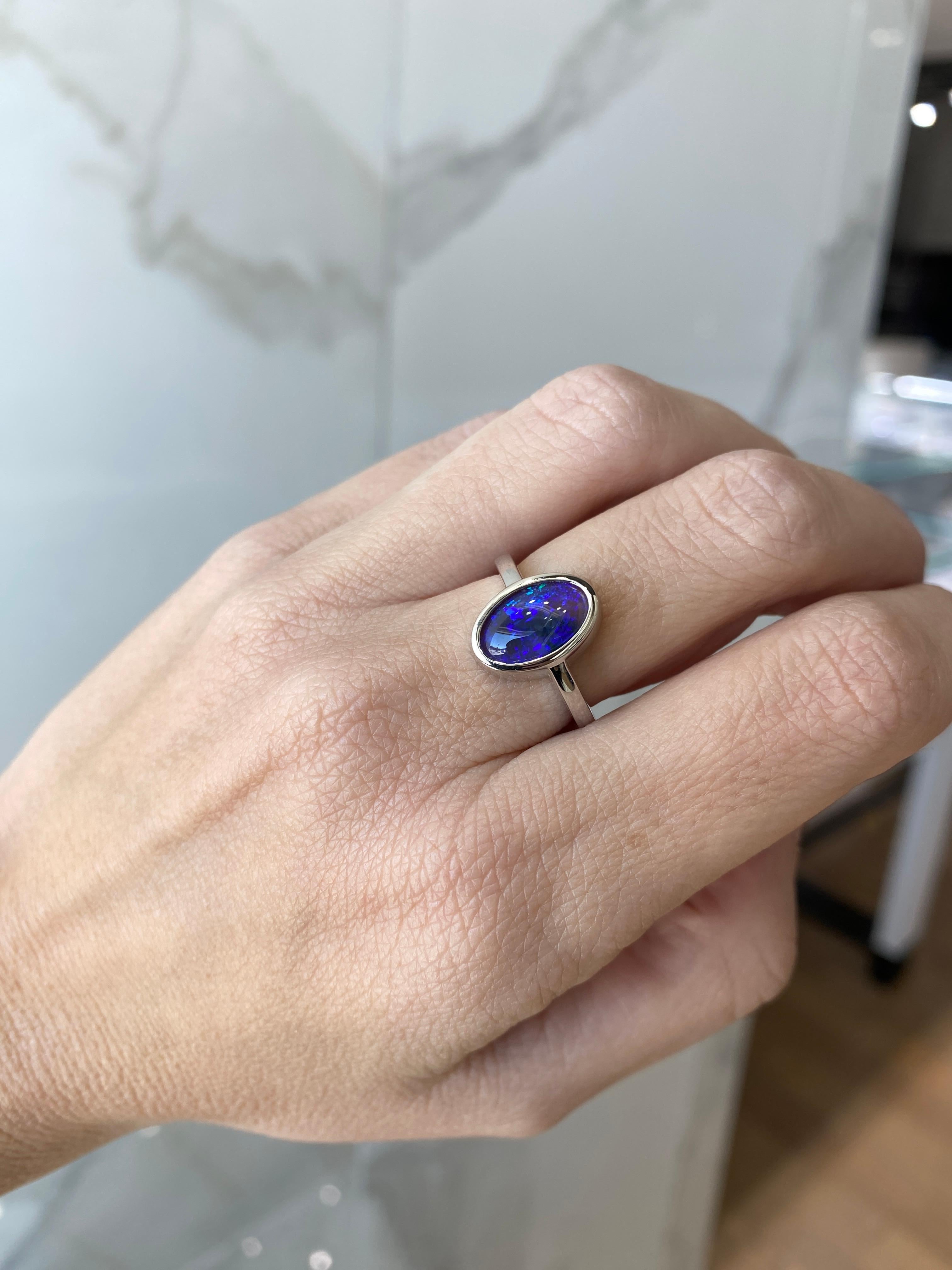 2.07 Carat Blue Oval Opal Bezel Set 18 Karat Gold Ring For Sale 1