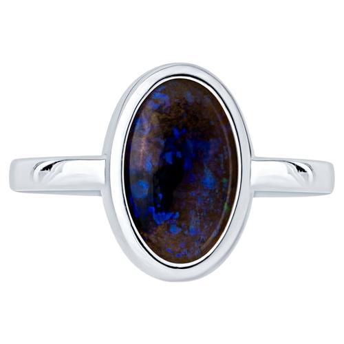 2.07 Carat Blue Oval Opal Bezel Set 18 Karat Gold Ring For Sale