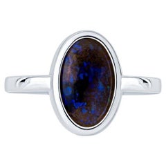 2.07 Carat Blue Oval Opal Bezel Set 18 Karat Gold Ring