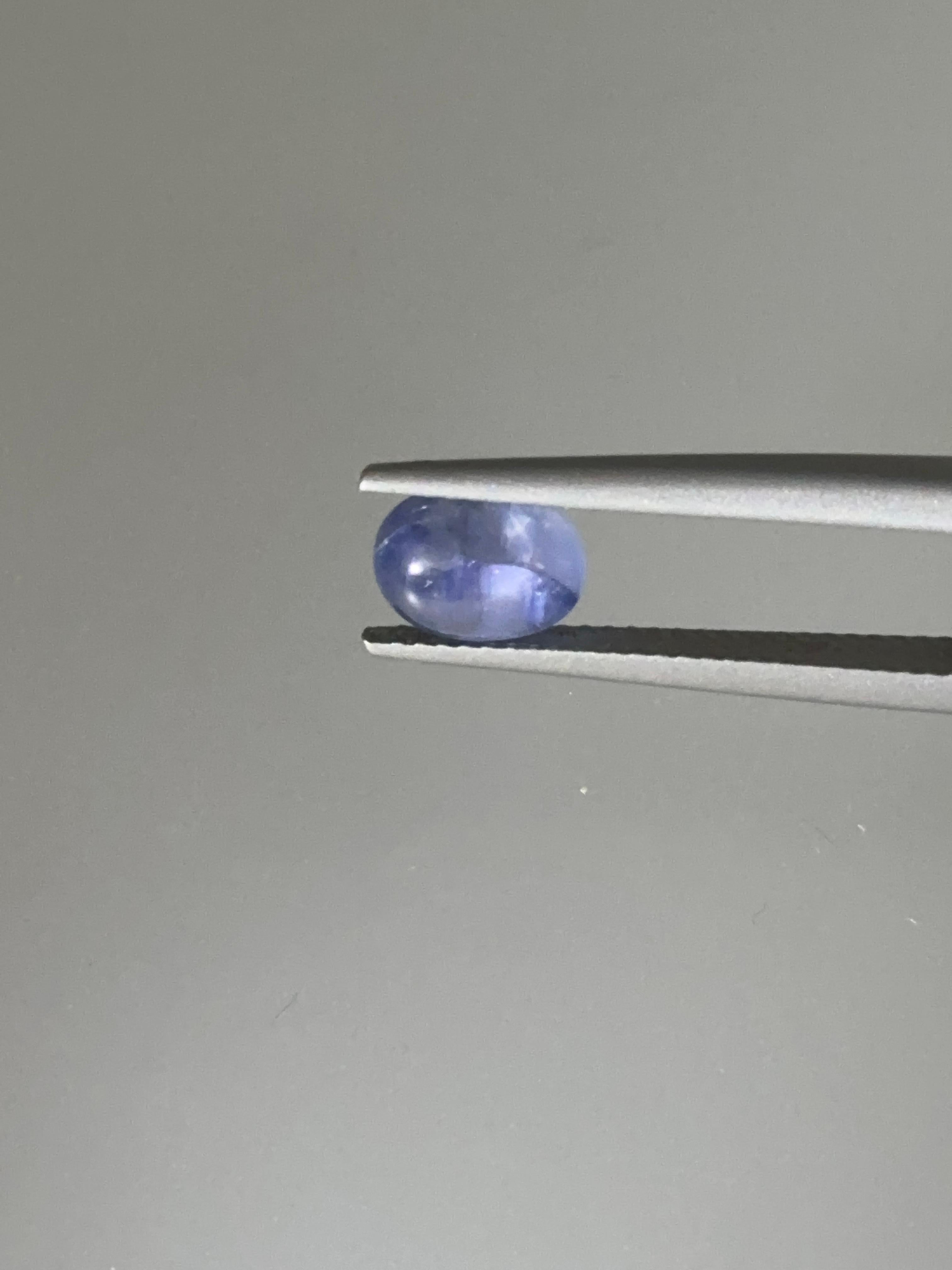 2.07 carat Oval Blue Cabochon Star Sapphire
Shape: Oval
Cut: Cabochon
Dimensions: 7.57 x 6.09 x 4.36 mm
Color: A light but yet prominent pastel-like blue.
Weight: 2.07 Carat
No Heat/Treatment
The stone's Asterism/Star Effect is not so prevalent but