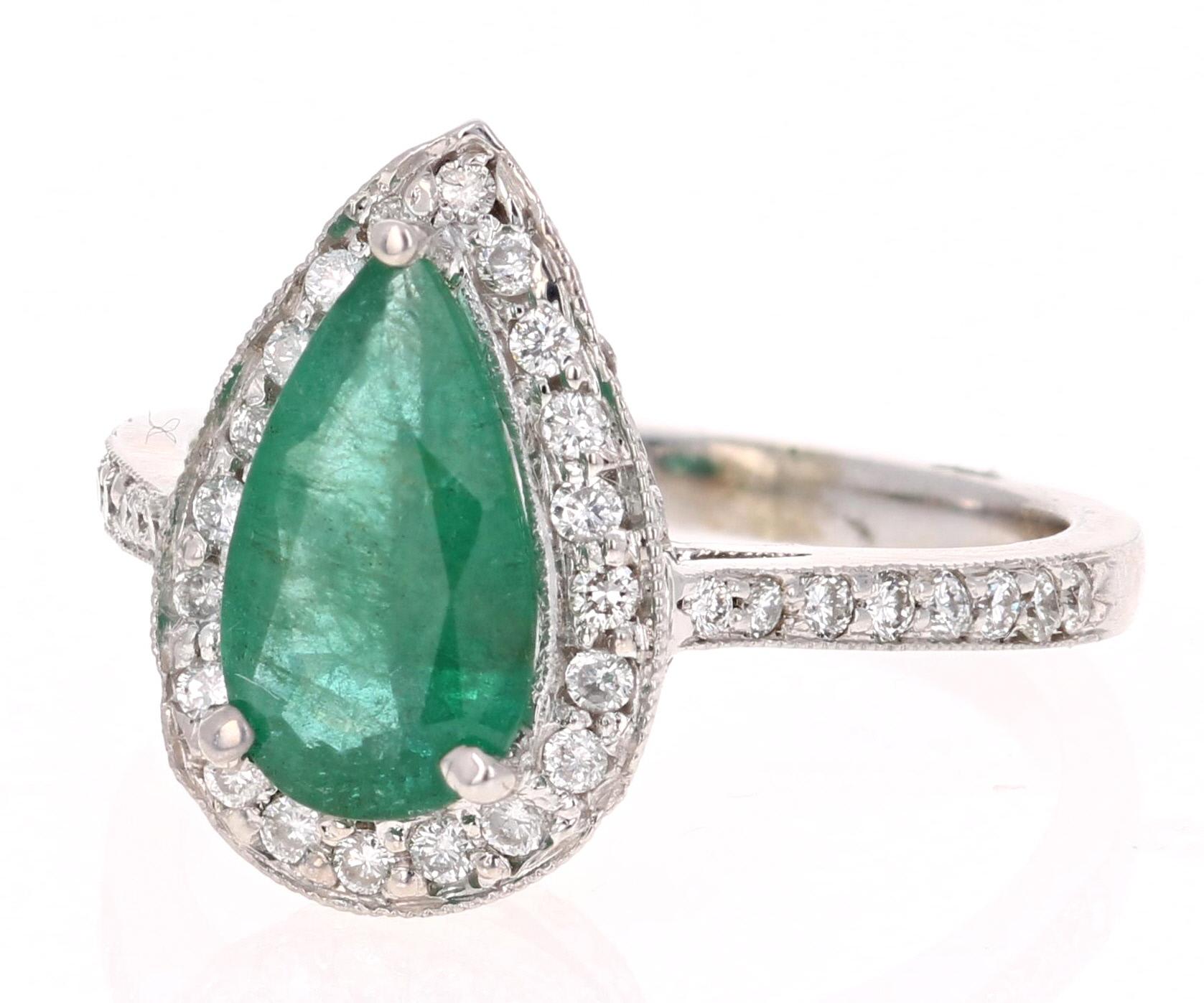 The Pear cut Emerald is 1.46 Carats and is surrounded by 75 Round Cut Diamonds at 0.61 Carats. The Clarity and Color of the Diamonds are VS2-H. 

It is set in 14K White Gold and is 4.8 grams. The ring is a size 7 and can be resized at no additional