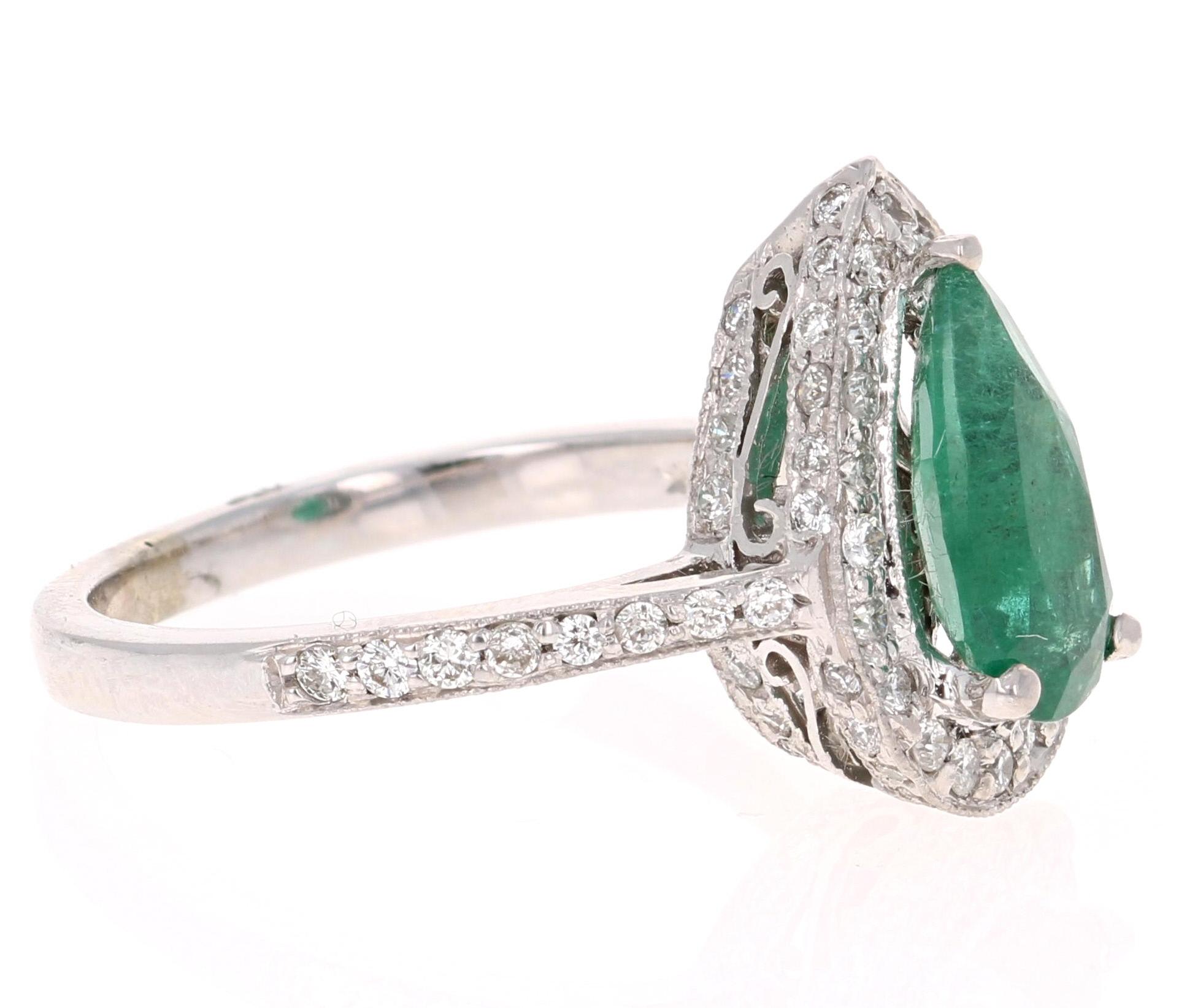 Contemporary 2.07 Carat Pear Cut Emerald Diamond Halo 14 Karat Gold Ring For Sale