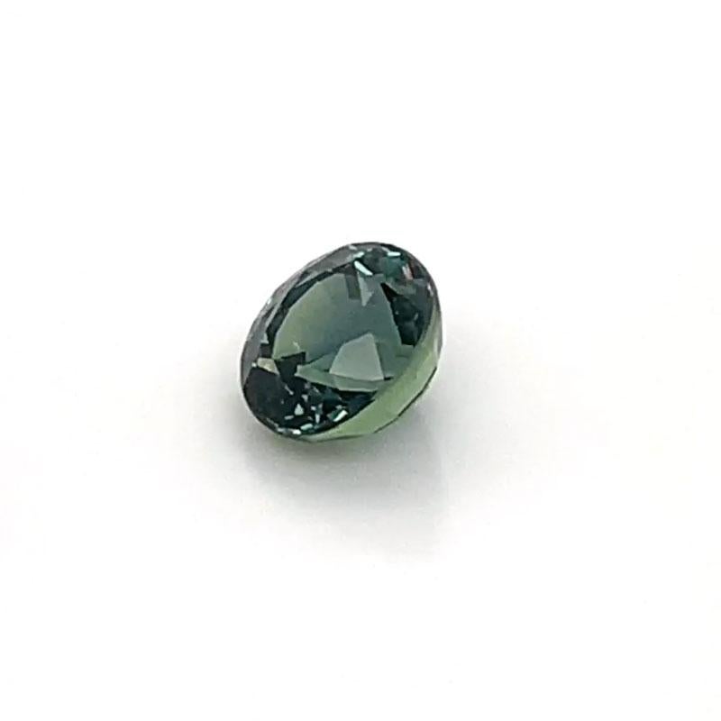 A Rare 2.07-carat Round  Natural Cushion Greenish Blue Unheated Sapphire GIA Certificate 5211043018 was hand-selected by our experts for its top luster and unique color. It's a mix of vibrant Green and Blue colors that creates a real Teal color