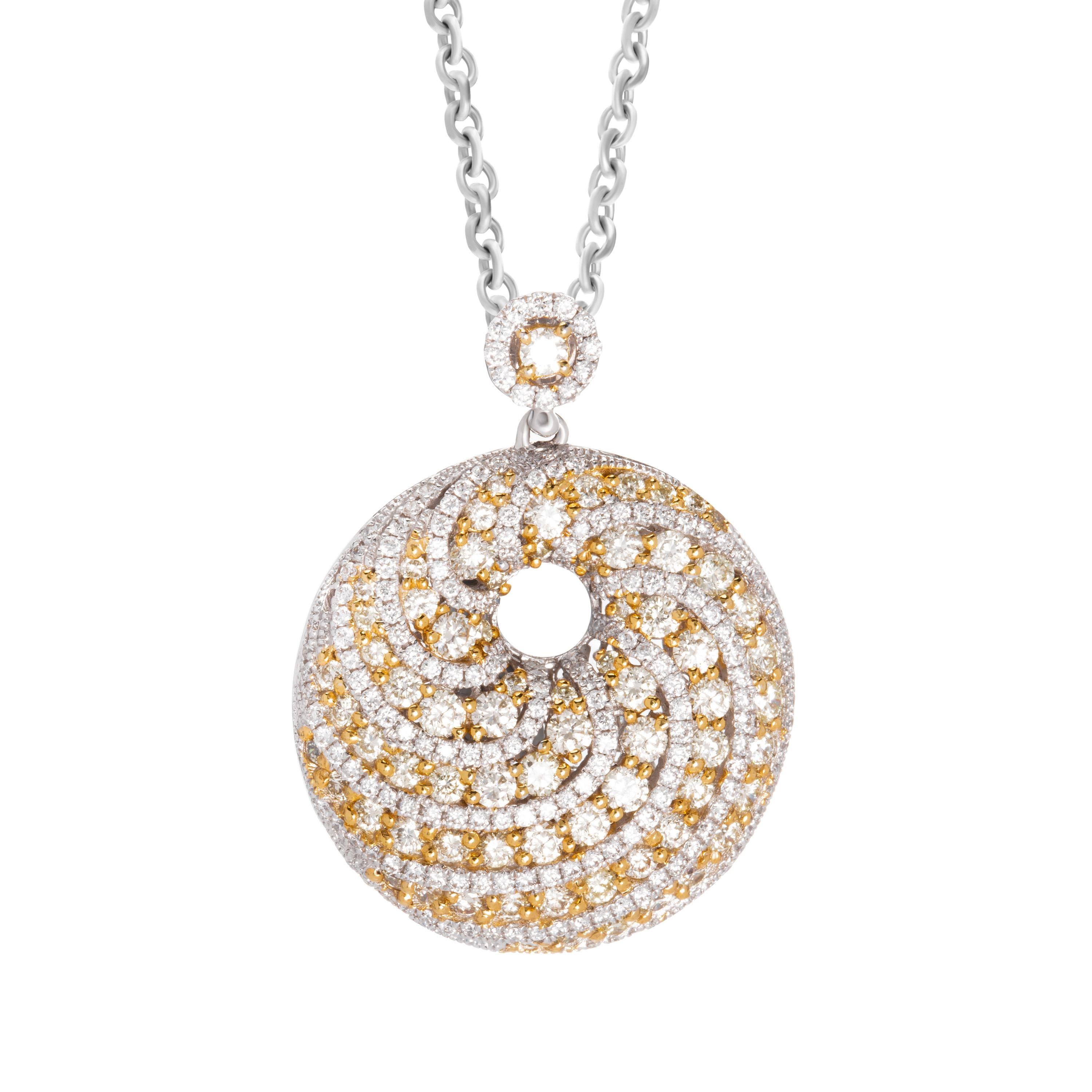 Butani's pendant is made from 18-karat white gold and encrusted with 2.07 carats of radiant yellow and white diamonds in a swirl bombe design.  Pendant diameter 2.2cm.  This pendant doesn't come with a chain.  For a chain to match, please contact