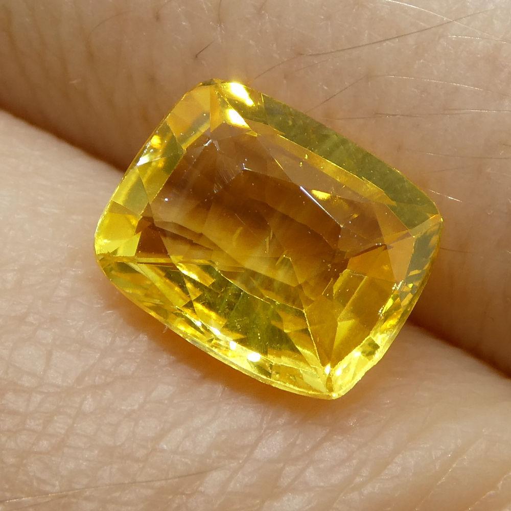 Description:

Gem Type: Yellow Sapphire 
Number of Stones: 1
Weight: 2.07 cts
Measurements: 8.08x6.66x3.71 mm
Shape: Cushion
Cutting Style Crown: Modified Brilliant Cut
Cutting Style Pavilion: Step Cut 
Transparency: Transparent
Clarity: Very