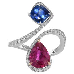 2.07 cts Certified Ruby, Blue Sapphire and Diamond Two-stone Crossover Ring (bague croisée à deux pierres)