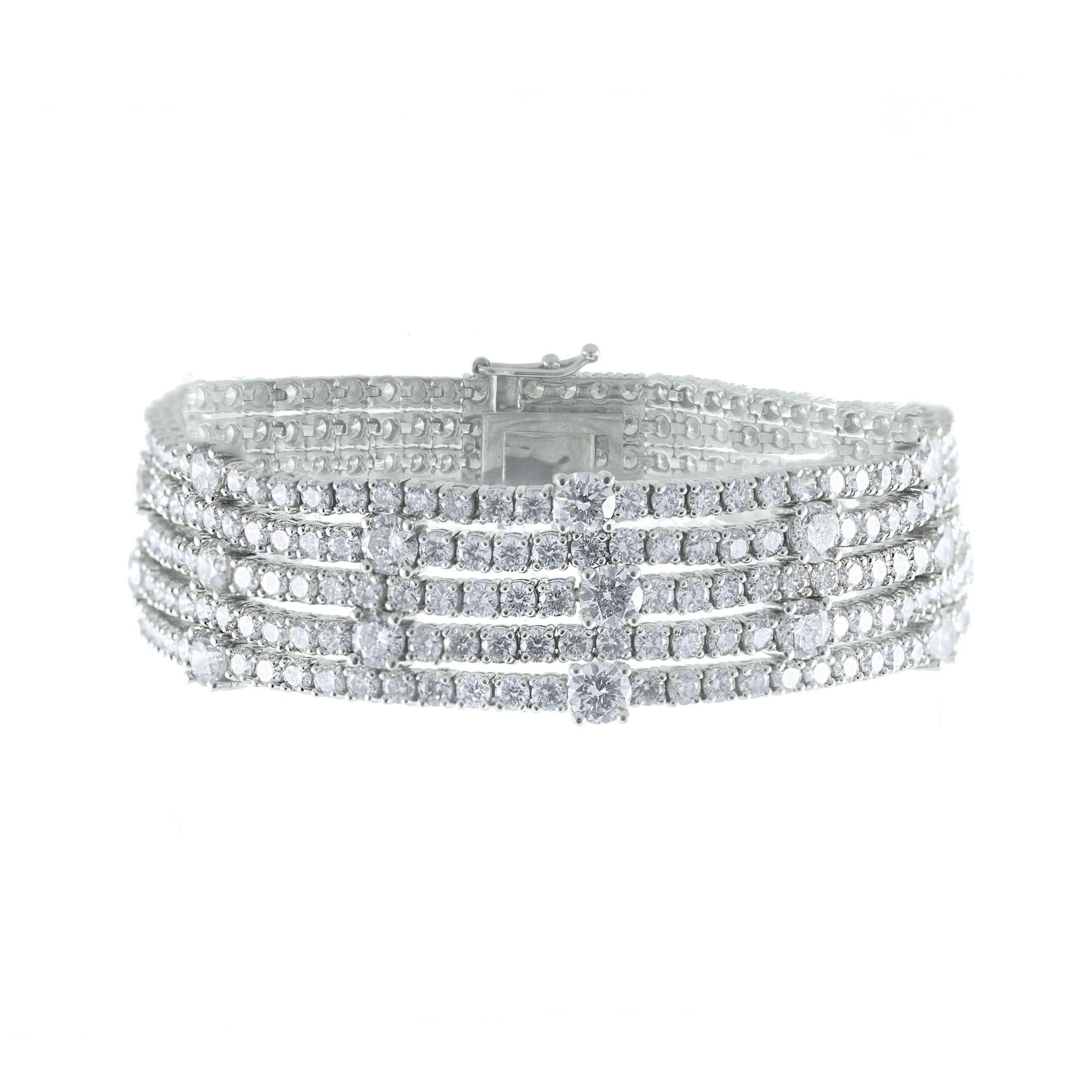 Make an unforgettable statement with this dazzling five-row diamond tennis bracelet, showcasing approximately 20.70 carats of natural round brilliant-cut diamonds. Designed with five continuous rows of shimmering stones, the bracelet delivers