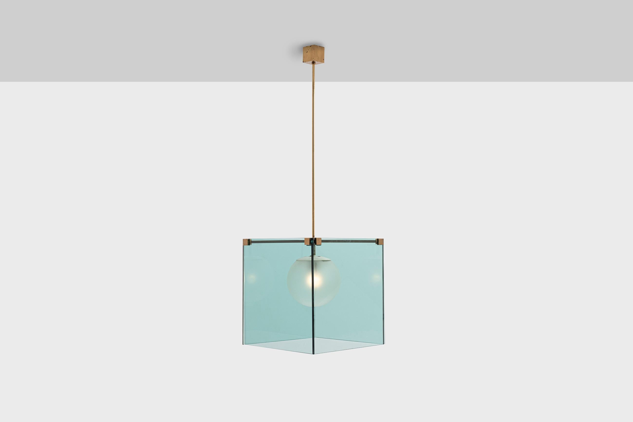 Rare chandelier mod. 2073 by Max Ingrand for Fontana Arte, Italy circa 1960. Sophisticated design composed of 'sea blue' colored glass plates, a frosted glass globe, white lacquered aluminium structure and brass framing. The warm colored brass