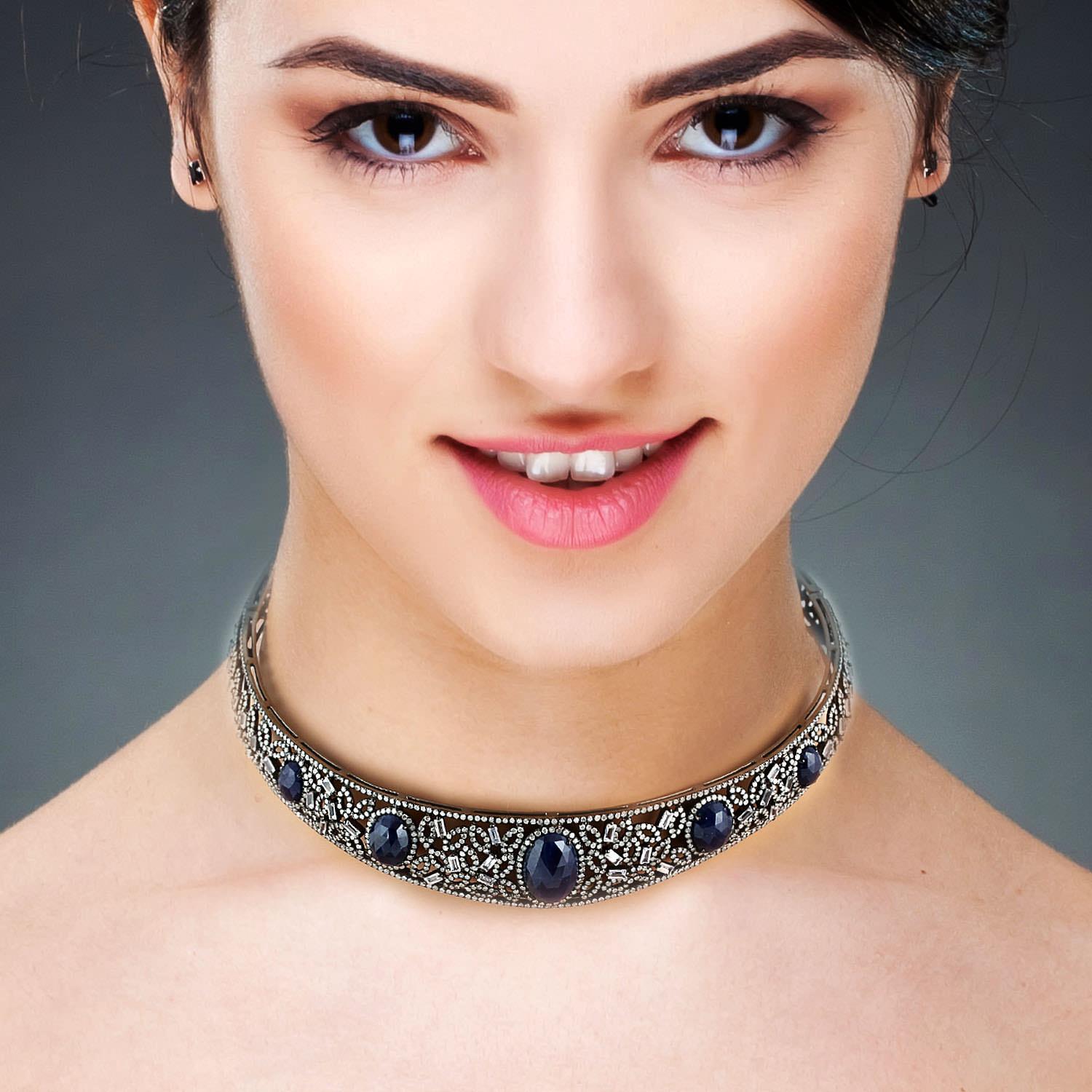 Cast in 18 karat gold and sterling silver, this stunning choker necklace is hand set in 20.75 carats blue sapphire and 5.72 carats of diamonds in blackened finish.

FOLLOW  MEGHNA JEWELS storefront to view the latest collection & exclusive pieces. 