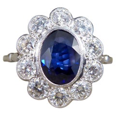 2.07ct Sapphire and 0.95ct Total Diamond Cluster Ring in Platinum 2.07ct Sapphire and 0.95ct Total Diamond Cluster Ring in Platinum