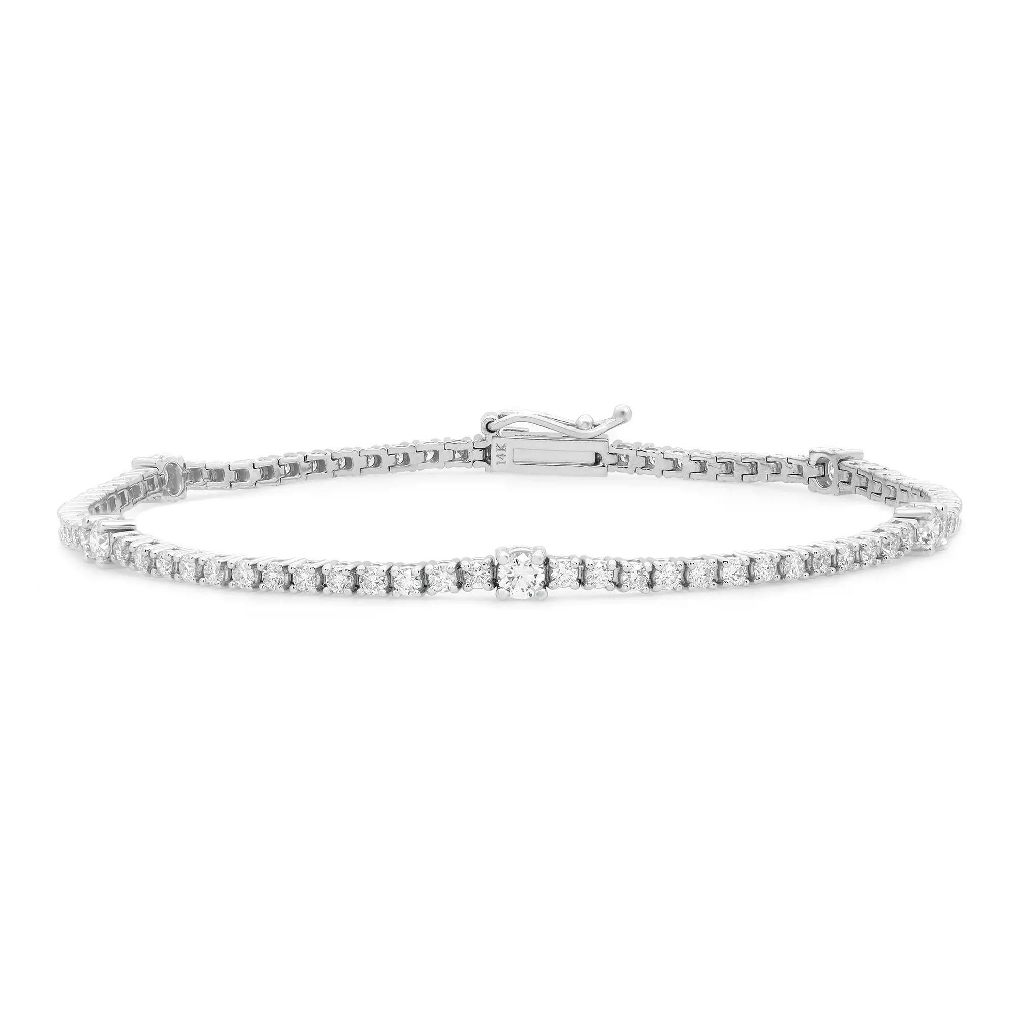 Classic yet elegant, this breathtaking tennis bracelet is crafted in 14K white gold with 88 prong set dazzling round brilliant cut diamonds. Total diamond weight: 2.07 carats with 5 diamonds size 8pt and the rest 2pt each. The bright white diamonds