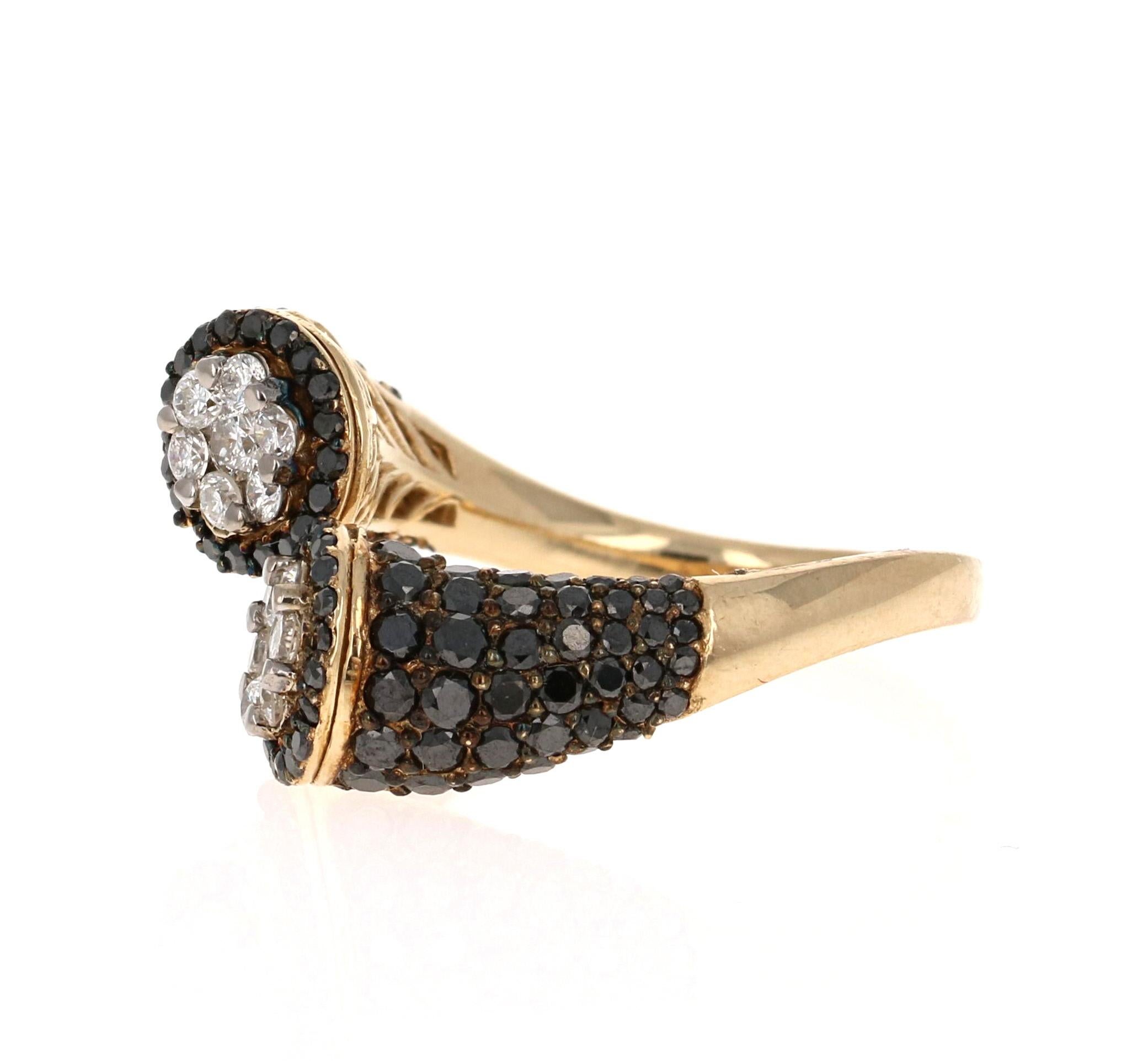 This gorgeous Yellow Gold Black Diamond Bridal Ring has been uniquely designed using Round Cut Black and White Diamonds that weigh a total of 2.08 Carats. The ring has 14 White Diamonds weighing 0.45 Carats (Clarity: SI, Color: F) which are designed