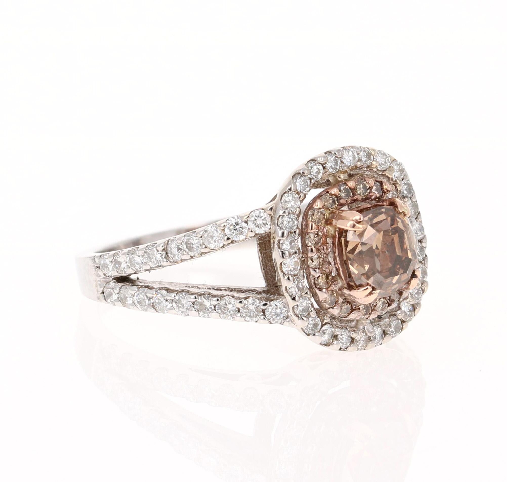 This ring has a Brown Cushion Cut Natural Diamond as its center weighing 1.09 Carats and is surrounded by a simple halo of 18 Round Cut Natural Brown Diamonds that weigh 0.14 Carats. It is further adorned with 62 Round Cut White Diamonds that weigh