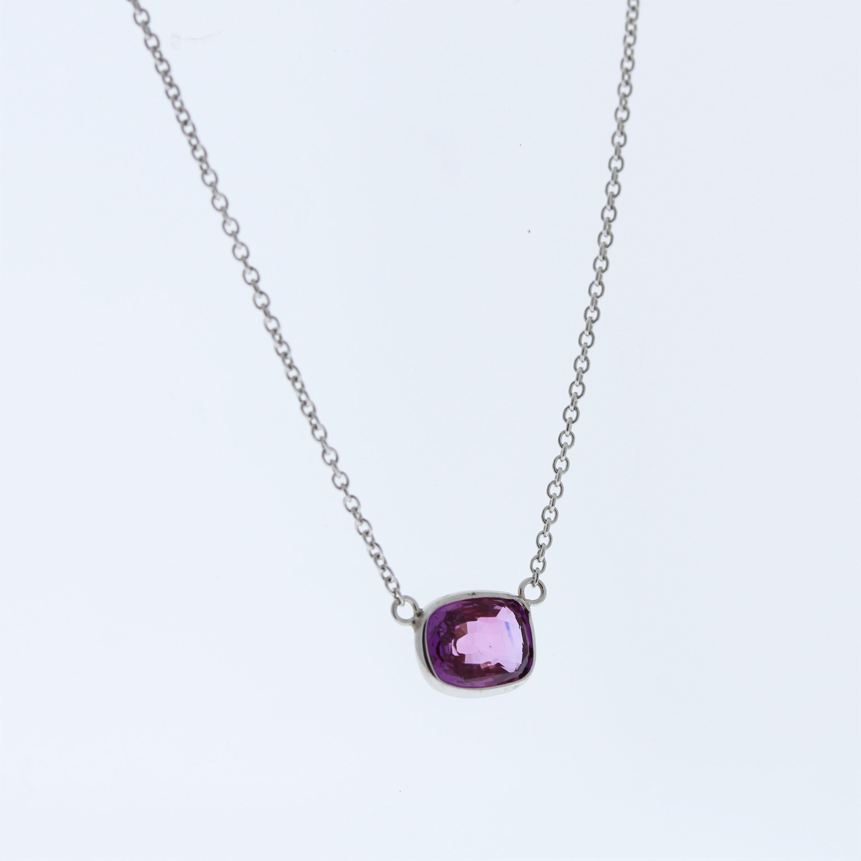 The necklace features a 2.08-carat cushion-cut purplish pink sapphire set in a 14 karat white gold pendant or setting. The combination of the purplish pink sapphire and the white gold setting likely creates an elegant and eye-catching piece of
