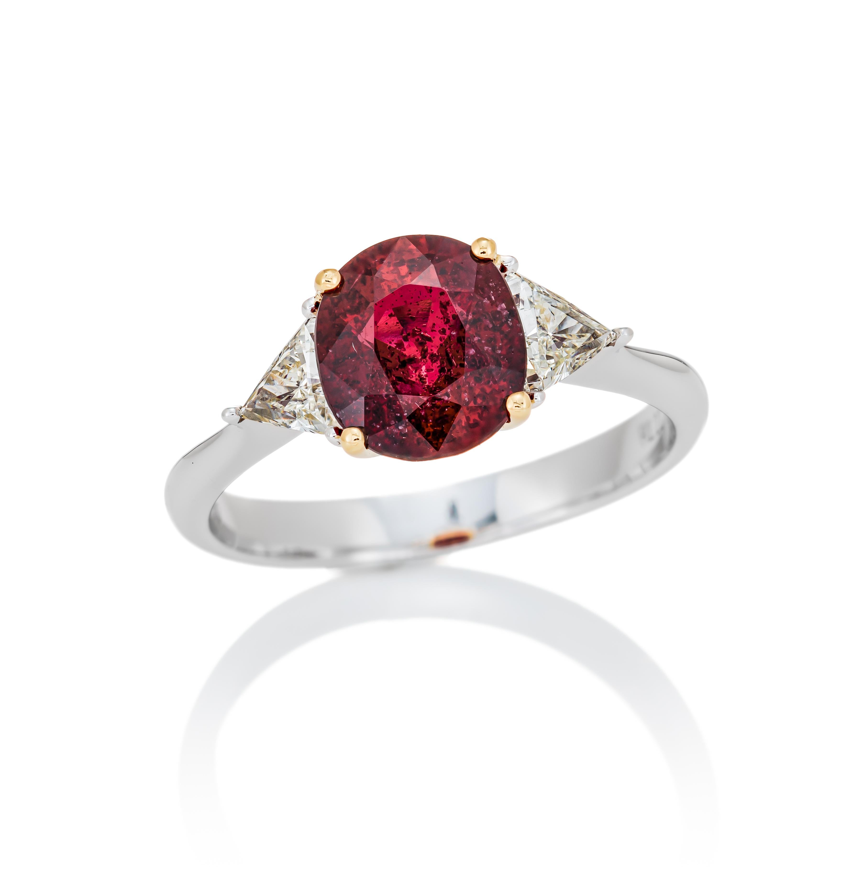 Primary Stone: Red Ruby (Mozambique)
Shape : Cushion Cut
Ruby Weight: 2.08 Carats 
Measurements Ruby : 8.63 x 7.48 x 3.49mm
Color: Red Ruby
Accent Stones: Genuine Diamond
Shape Or Cut Diamond: 
Average Color/clarity Diamond: F/G VS
Composition: