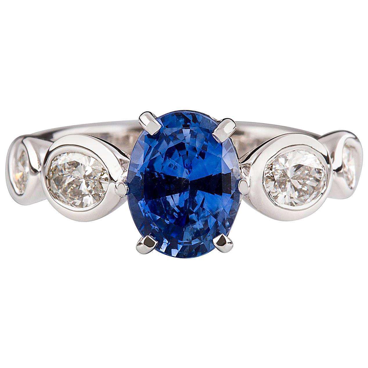 2.08 Carat Oval Cut Ceylon Sapphire 1.18 Carat Diamond Engagement Ring For Sale
