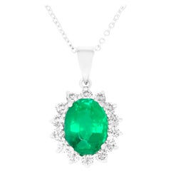 Oval Cut Emerald Surrounding Round White Diamond Pendant 14K White Gold