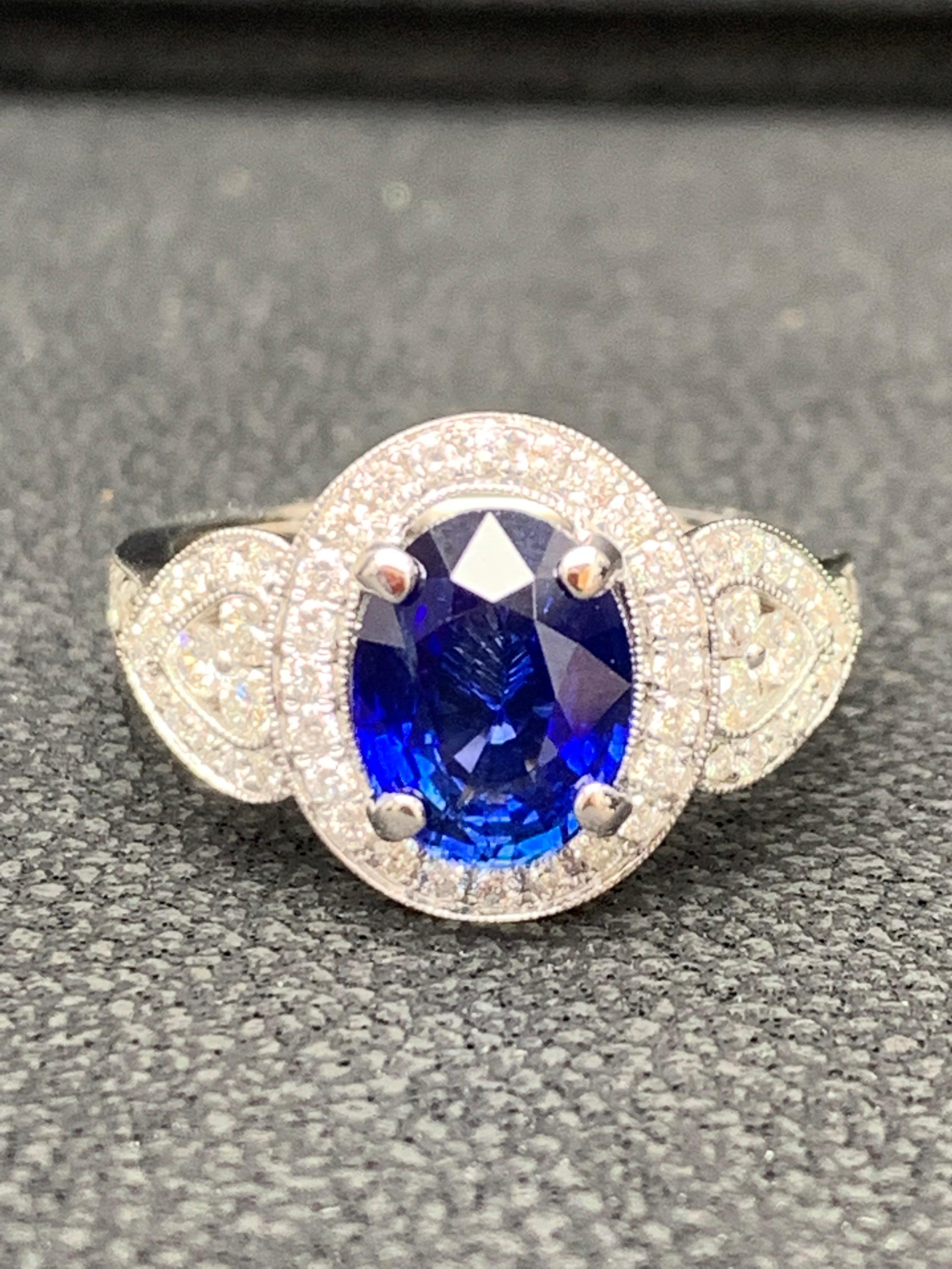 2.08 Carat Oval Cut Sapphire and Diamond Engagement Ring in 18K White Gold In New Condition For Sale In NEW YORK, NY