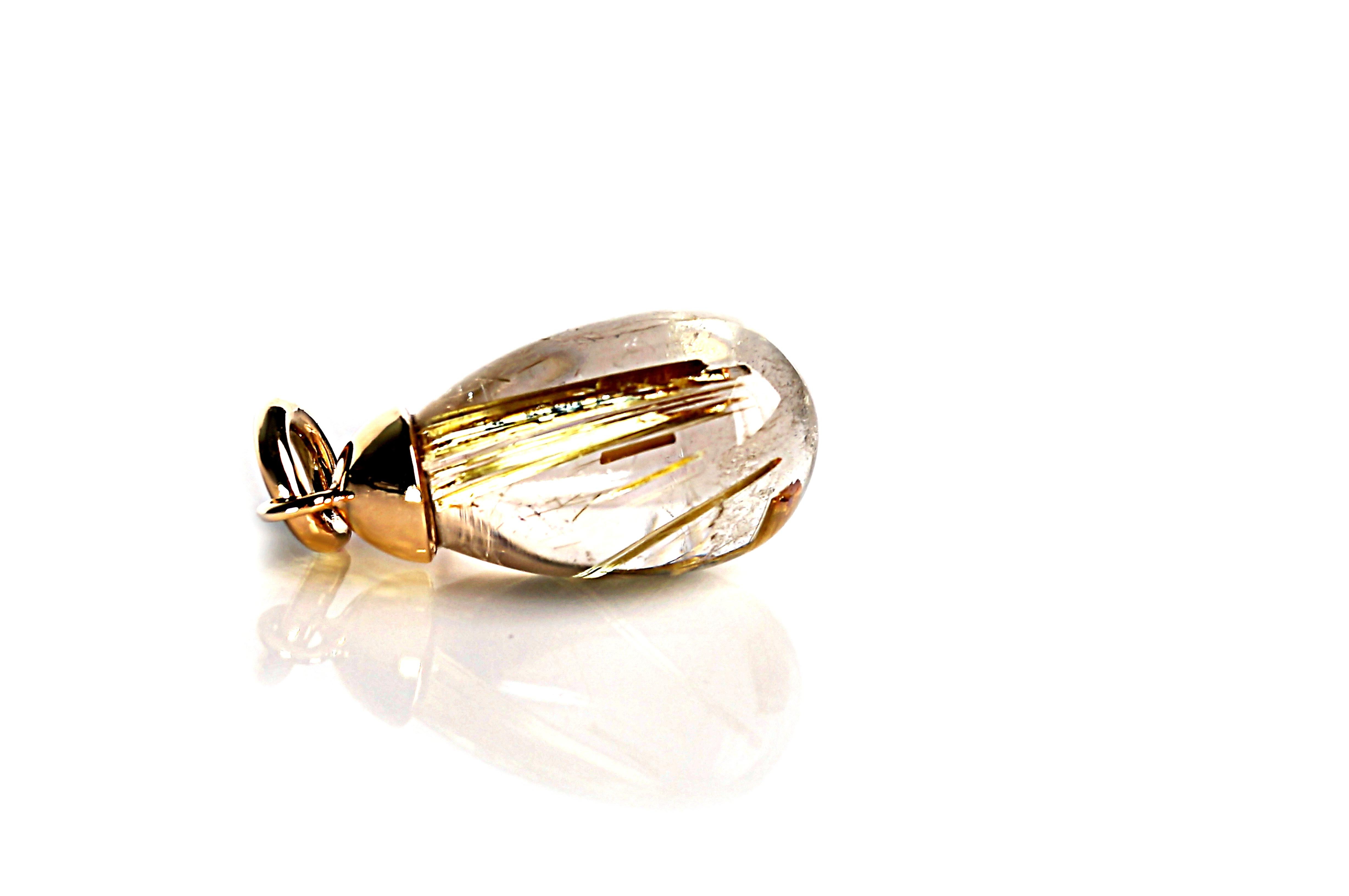 ACUS:

This timelessly beautiful and elegant pendant, crafted from 18-carat rose gold, features a Rutilated Quartz briolette weighing 20.8 carats. The pendant is delivered with a black, braided genuine leather strap that has an 18-carat yellow gold
