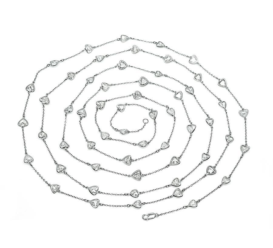This is a stunning platinum by the yard necklace. The necklace is set with sparkling heart shape diamonds that weigh approximately 20.80ct. The color of these diamonds is I-J with SI1 clarity. The necklace measures 58.5 inches in length and weighs