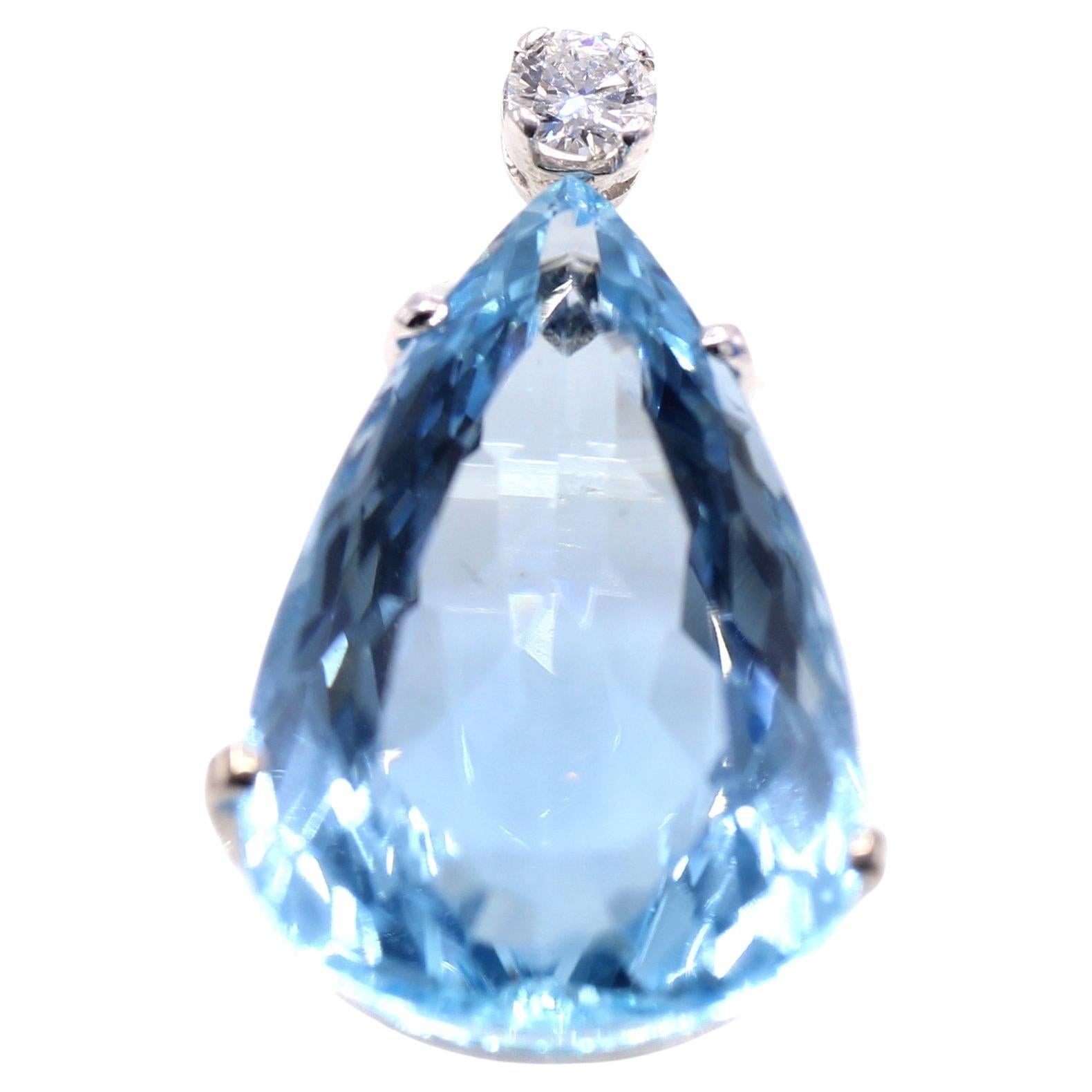 A beautifully cut Santa Maria blue pear shape aquamarine is the center piece of this lovely pendant. Set in a 18 karat white gold handcrafted pendant with a bright white round brilliant cut diamond at the top of the bail. The pendant is accompanied