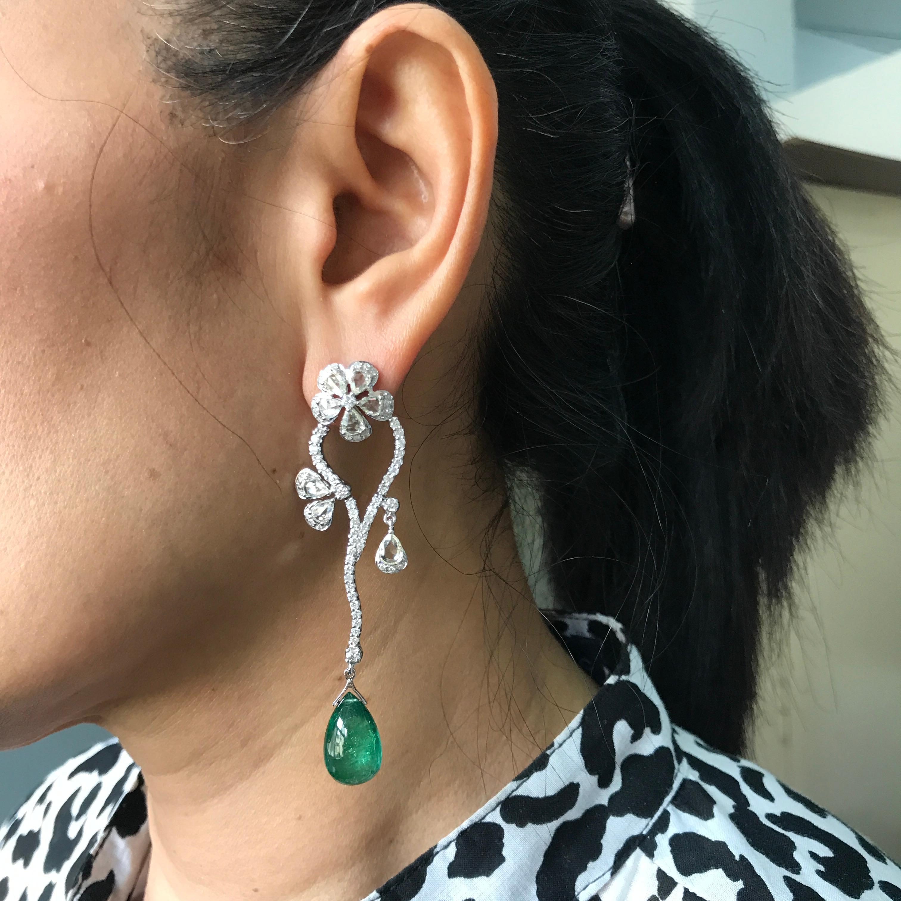 A stunning pair of 19.912 carat Emerald Drops. The Zambian Emeralds used are transparent with a few natural inclusions, but that does not affect the extreme luster of the Emeralds. Drilled on the tip of the drops, so can be used to make jewelry. 