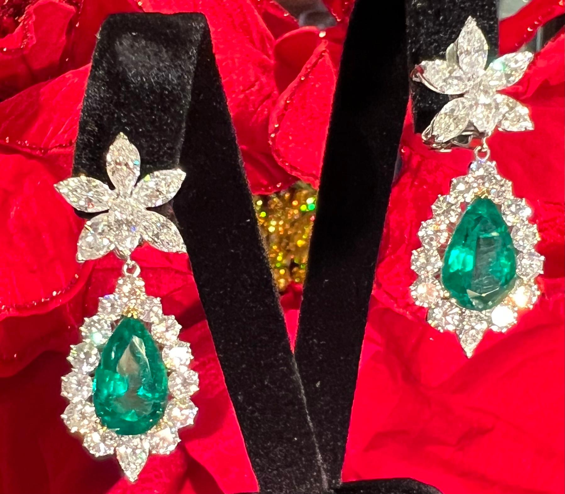 Magnificent pair of very noteworthy 20.88 carat estate Diamond and Emerald Drop Earrings are set in platinum.  These are the most beautiful emerald and diamond earrings I have ever laid my eyes on. The emeralds detach so that the diamond cluster can