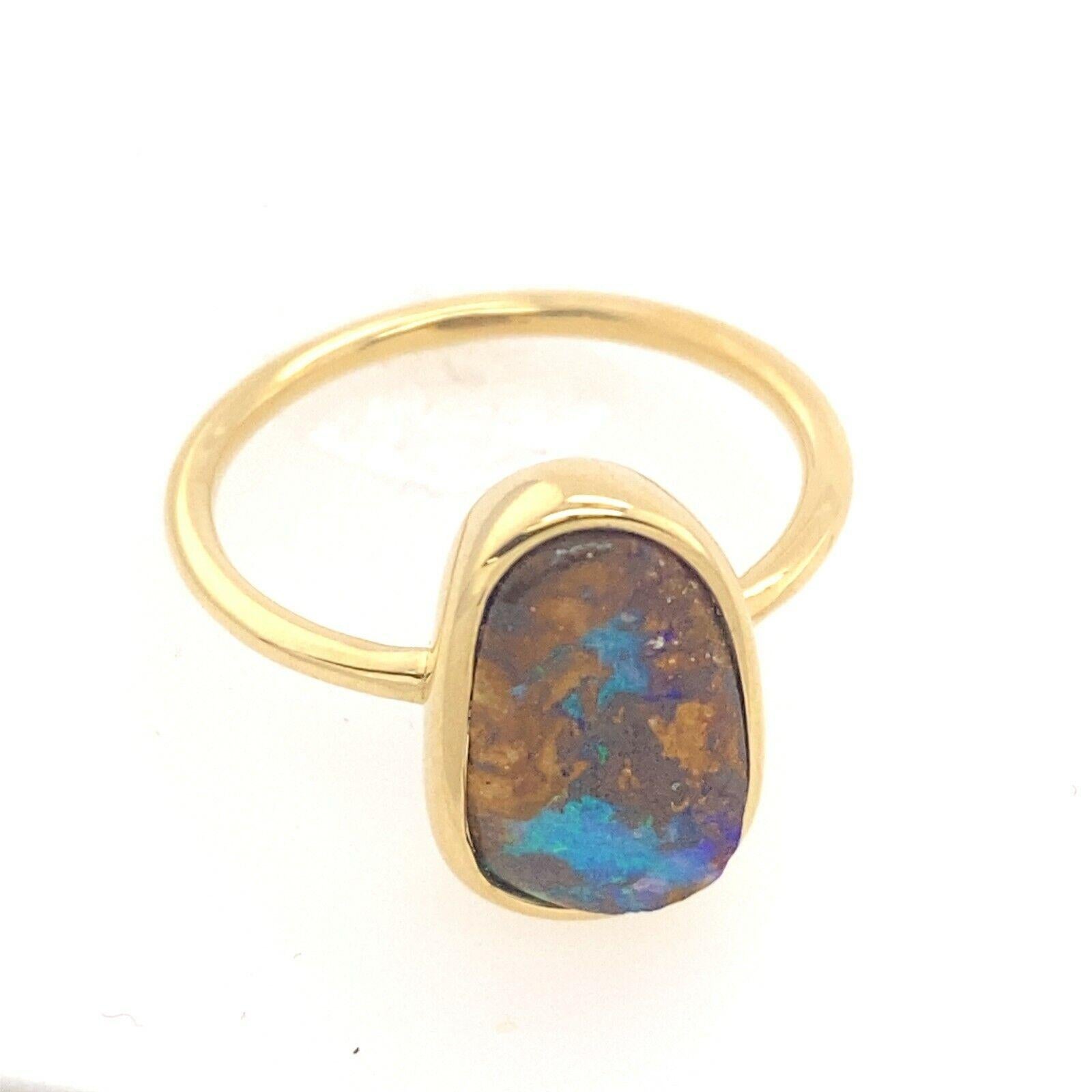 2.08ct Natural Multicolored Opal, Set in Rubover Setting, In 18ct Yellow Gold

Additional Information:
Total Opal Weight : 2.08ct
Width of Band : 1.44mm
Width of Head:9.2mm
Length of Head: 13.88mm
Total Weight: 3.3g
Ring Size: M1/2