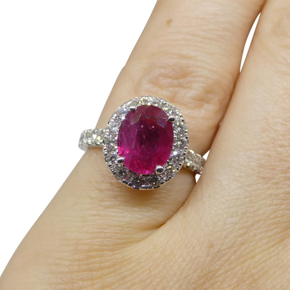  

Introducing our breathtaking 2.01ct Red Ruby and Diamond Halo Statement or Engagement Ring, set in luxurious 14k White Gold and GIA certified from Mozambique. This enchanting piece is designed to captivate with its vibrant purplish-red