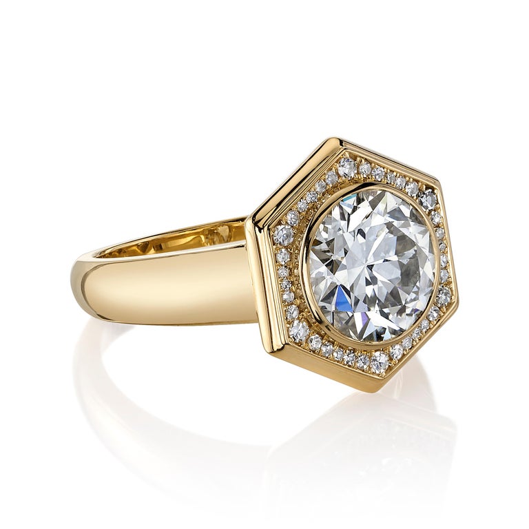 2.08ct L/VVS2 GIA certified old European cut diamond with 0.10ctw single cut accent diamonds set in a handcrafted 18K yellow gold mounting.


