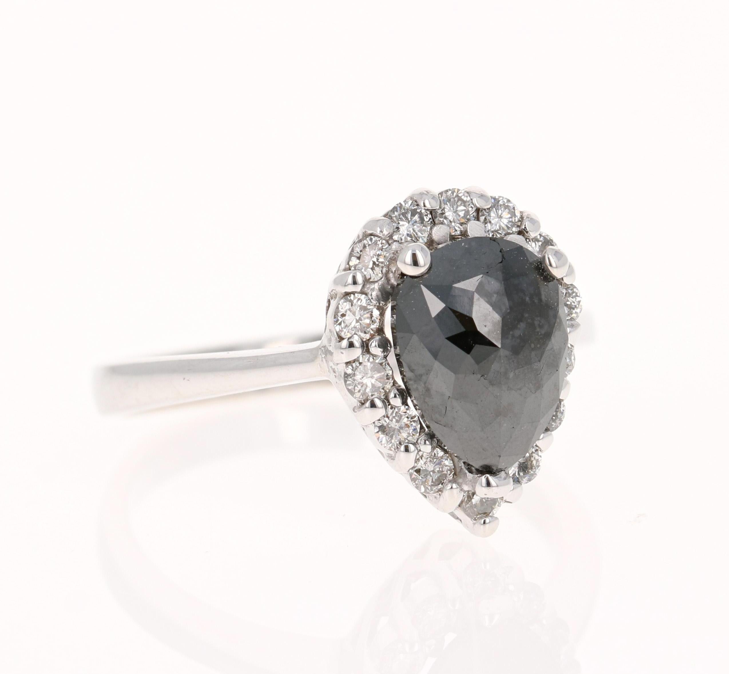 This Black and White Diamond Ring is a unique Engagement Ring or an every day ring! 

Beautiful Pear Cut Black Diamond that weighs 1.75 Carats and is surrounded by 14 Round Cut Diamonds that weigh 0.34 Carats. The clarity and color of the diamonds