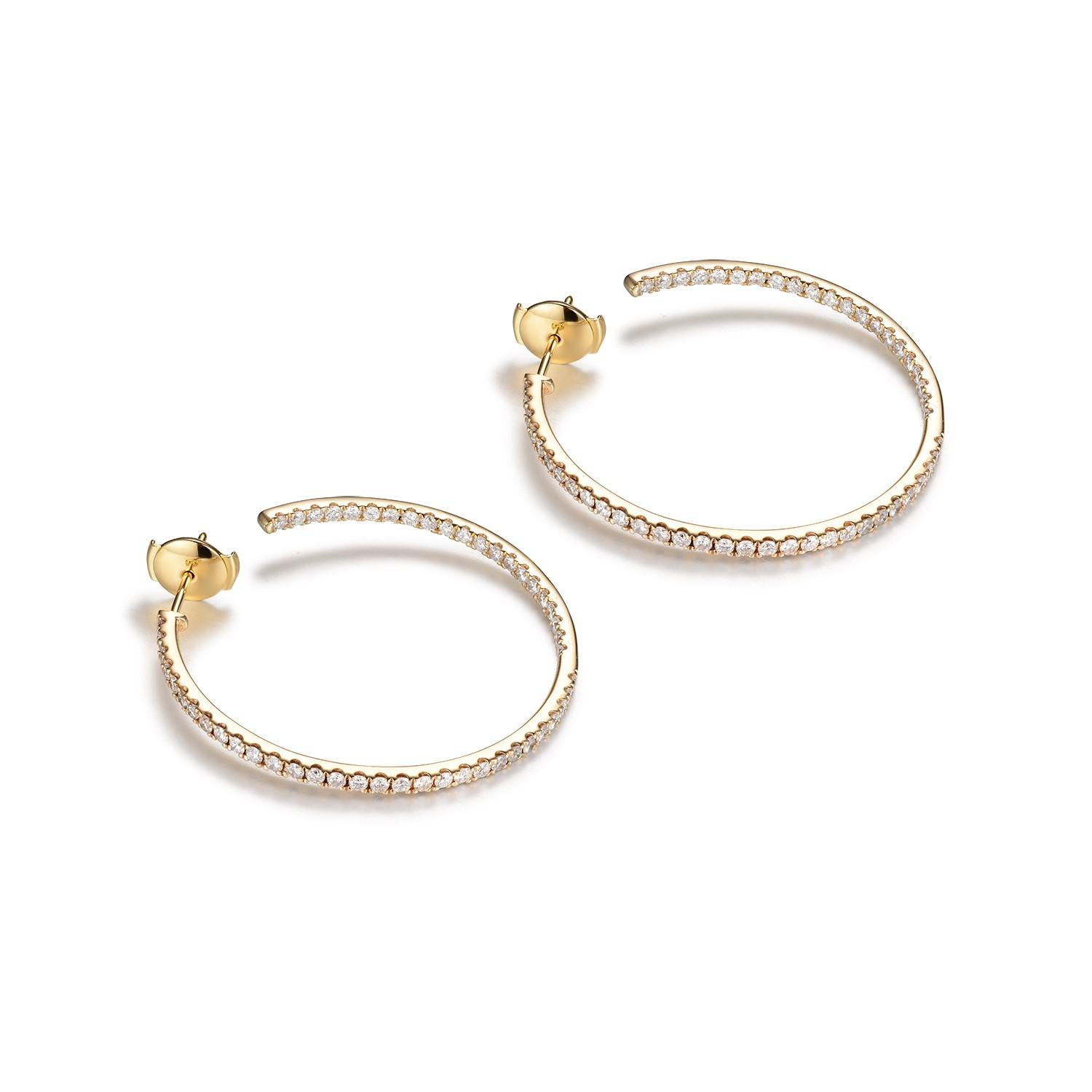 These elegant hoop earrings are crafted from 14K yellow gold, offering a classic and warm aesthetic. Each earring is embellished with a generous array of diamonds, totaling 2.09 carats, that encircle the hoop in a continuous loop of radiance.

The