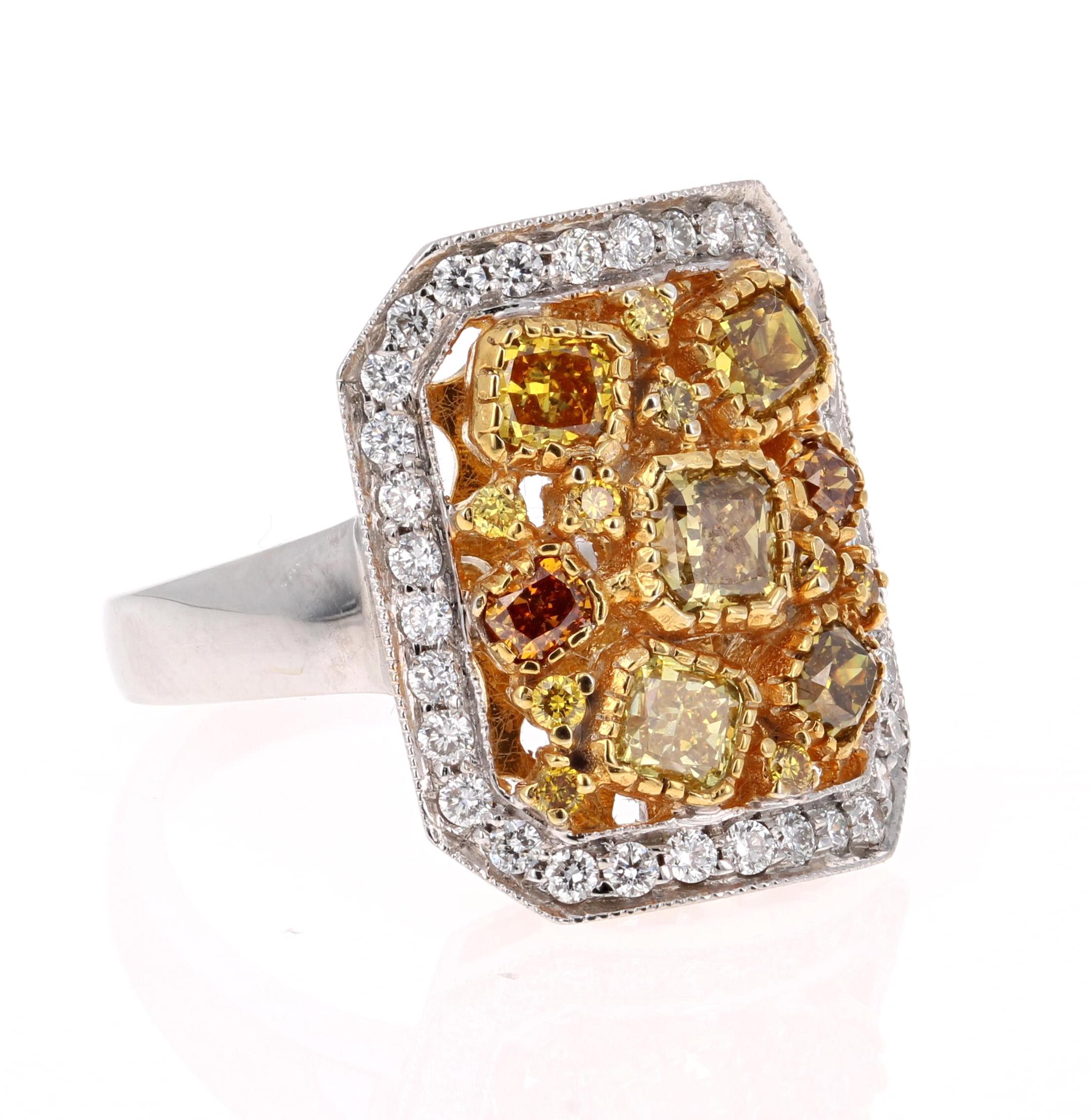This magnificent beauty has Fancy Color Cushion Cut Natural Diamonds floating around the ring. The 7 Fancy Color Cushion Cuts weigh 1.49 Carats. It is embellished with 9 Yellow Round Cut Diamonds that weigh 0.12 Carats. It is further adorned with 34